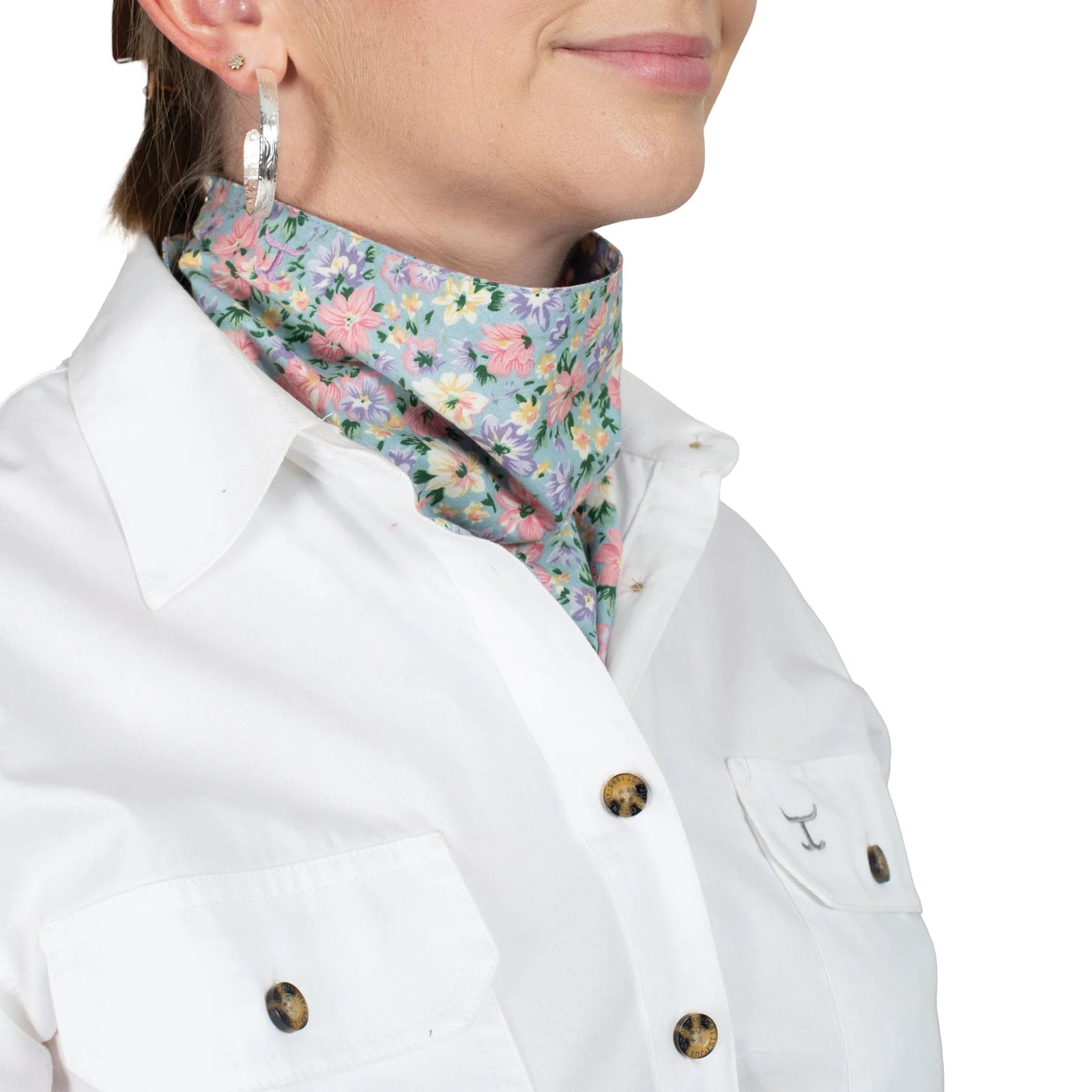 Just Country Carlee Double Sided Scarf. Person wearing a floral neck scarf with a white shirt on a white background