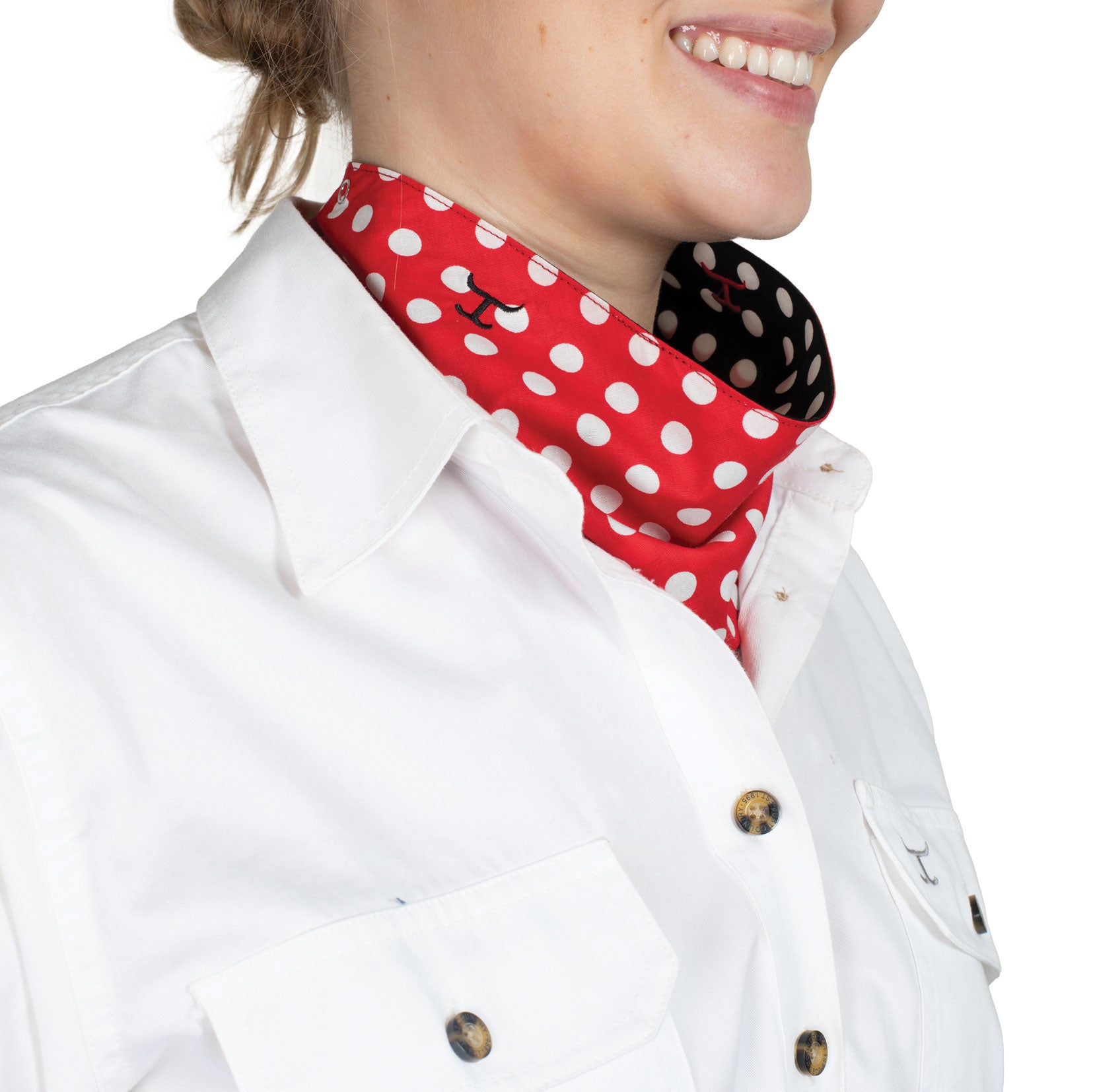 Just Country Carlee Double Sided Scarf. Person wearing a white shirt with a red and white polka dot scarf around their neck.