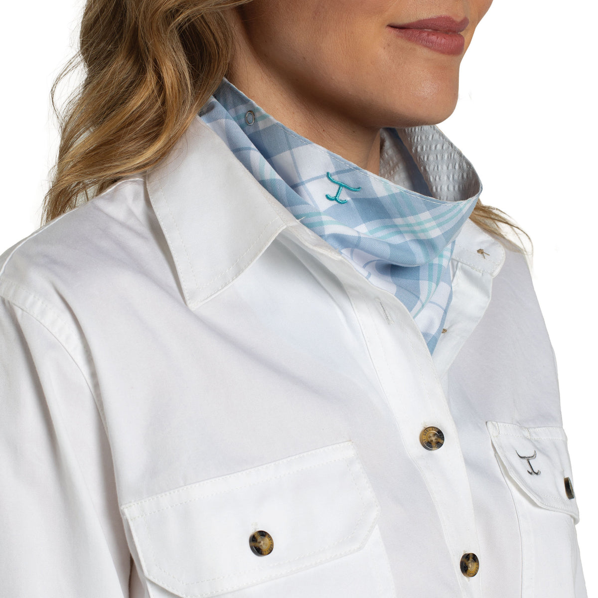 White jacket with a plaid shirt underneath on a white background