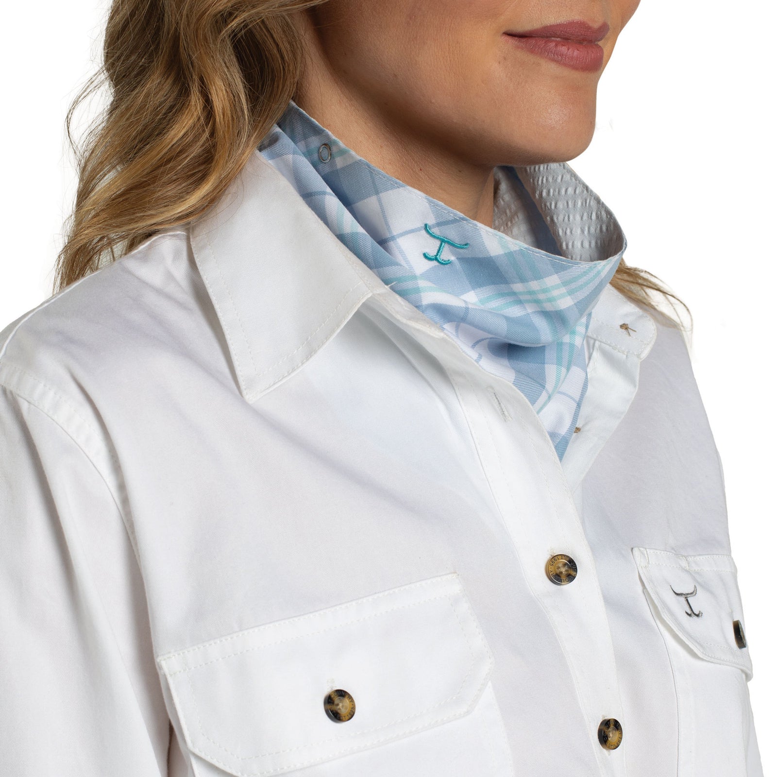 White jacket with a plaid shirt underneath on a white background