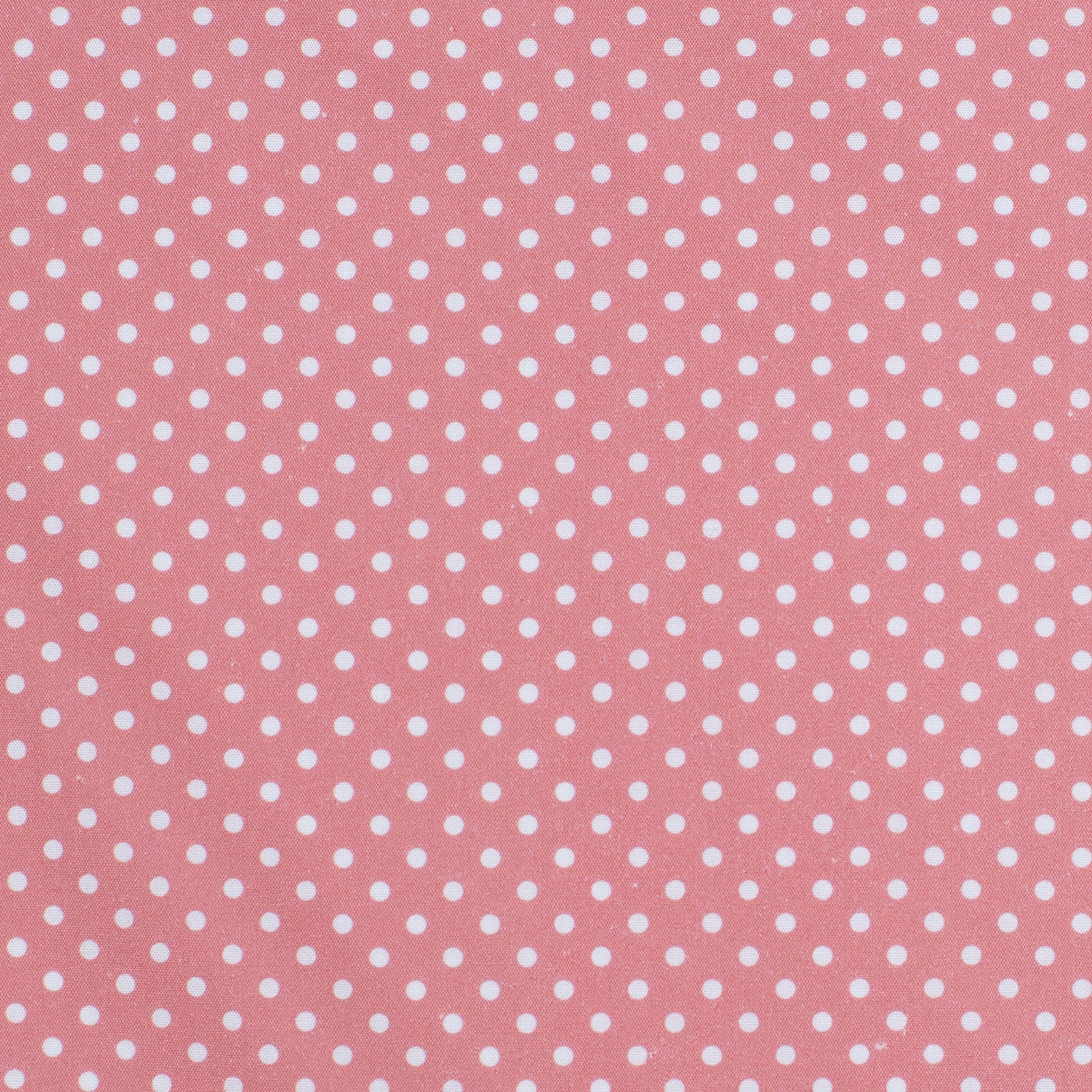 Pink fabric with white polka dots