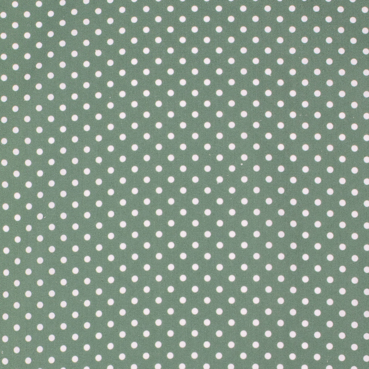 Green fabric with white polka dot pattern
