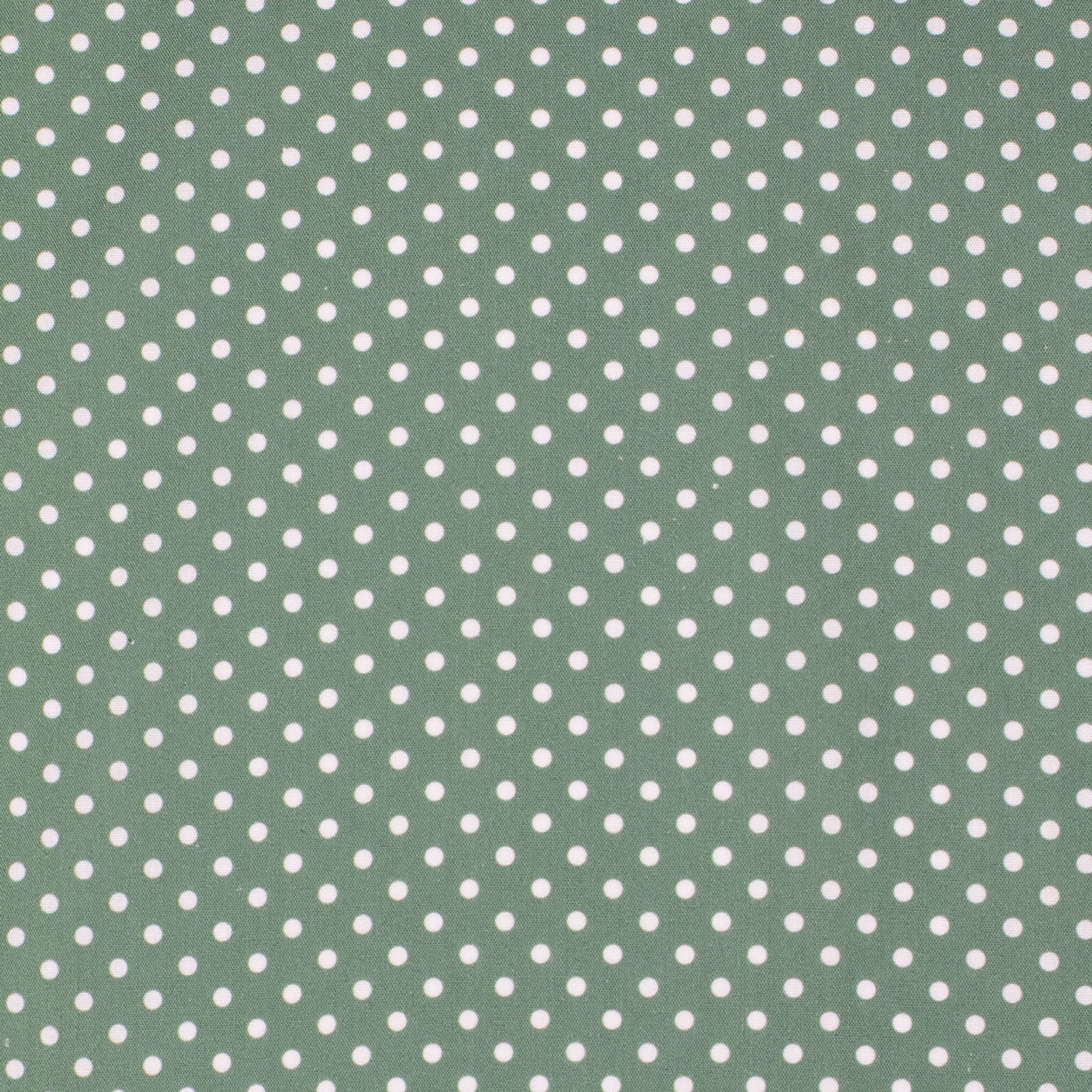 Green fabric with white polka dot pattern