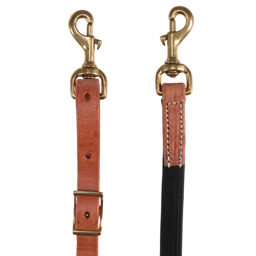 Two leather straps with brass-toned metal swivel clamps, shown side by side on a plain white background. One strap is tan/cognac leather with brass hardware, and the other is split with a black lower section and tan leather upper section with white stitching.