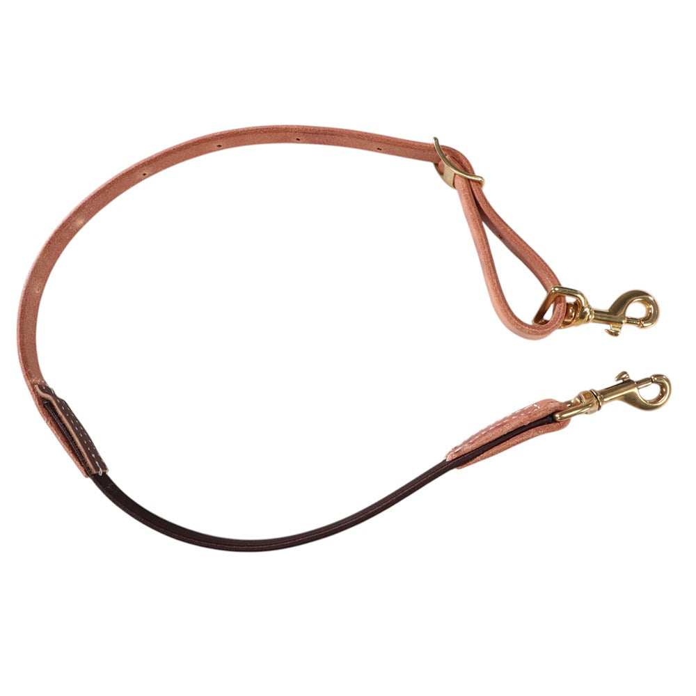 A leather horse lead rope with a warm pinkish-brown leather body, a dark brown section, and brass-colored metal snap hooks, shown on a plain white background.