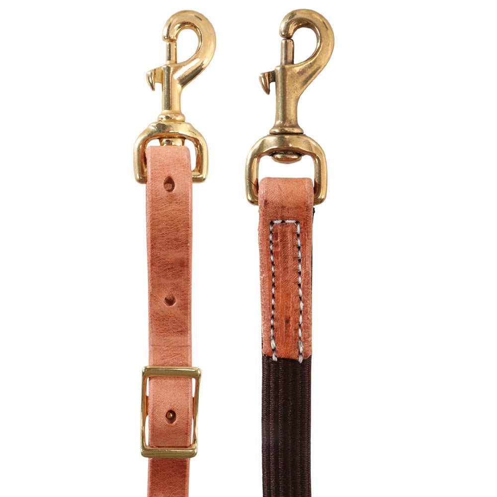 Two leather dog leashes with brass hardware shown side by side on a white background. The left leash is light tan leather with a gold-tone buckle and swivel clasp.