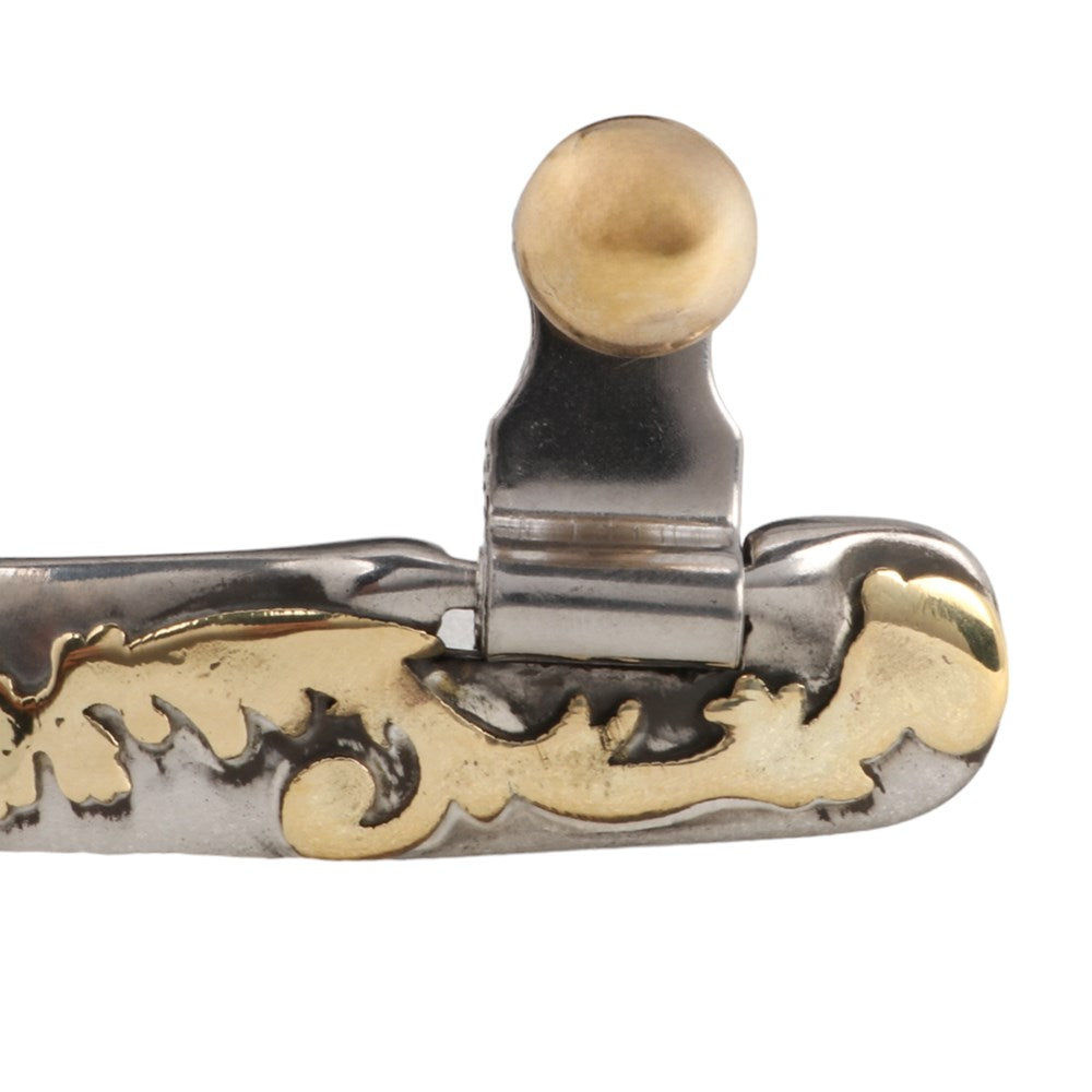 Pro Cutter Show Spurs. Decorative metal handle with gold and silver design on a white background