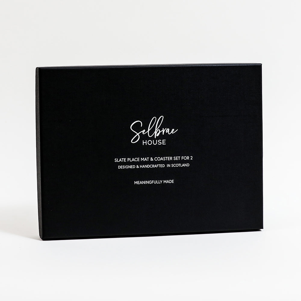 A black rectangular presentation box with white printed text reading 'Selbie House' and smaller product details, photographed on a clean white background.