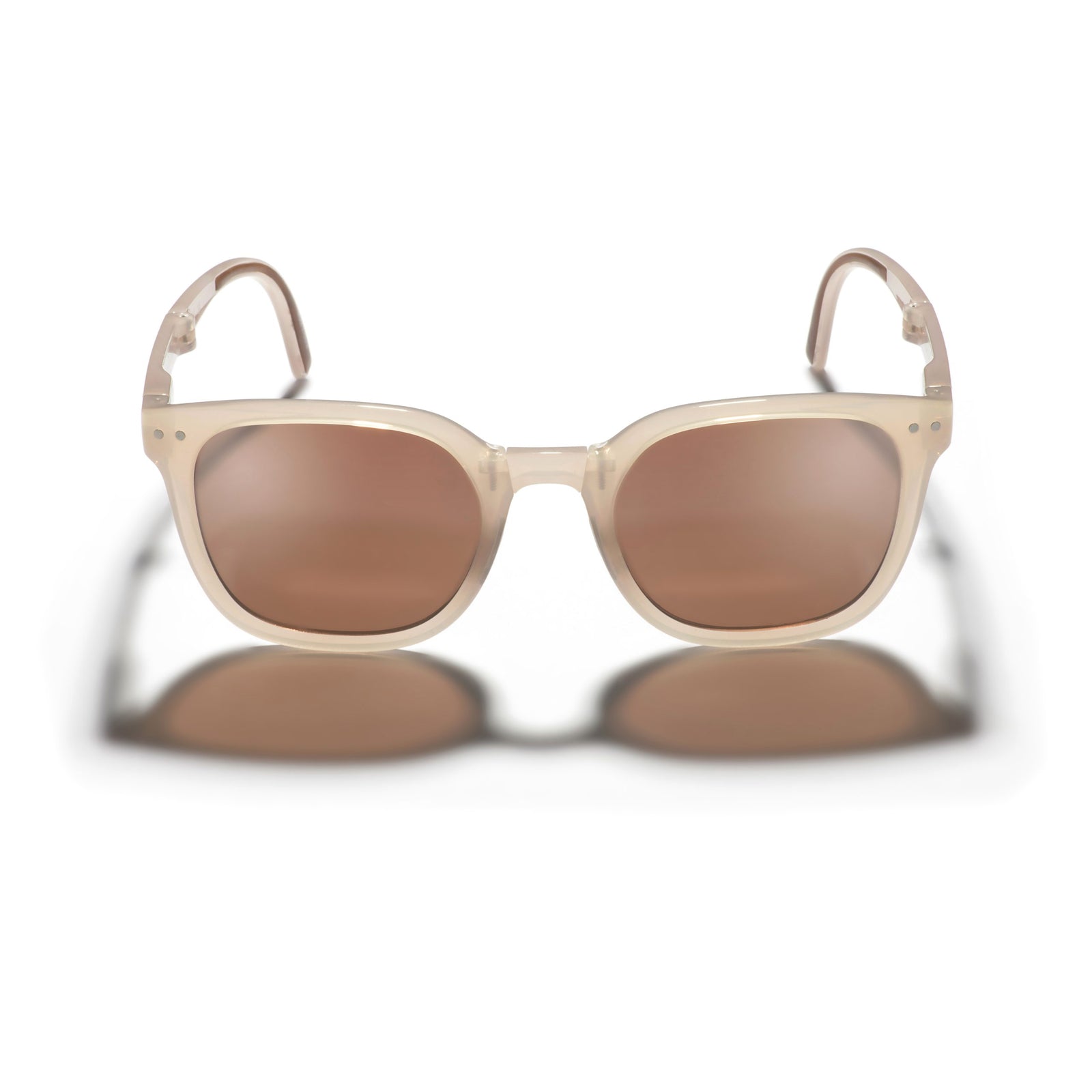 Beige sunglasses with brown lenses on a white background