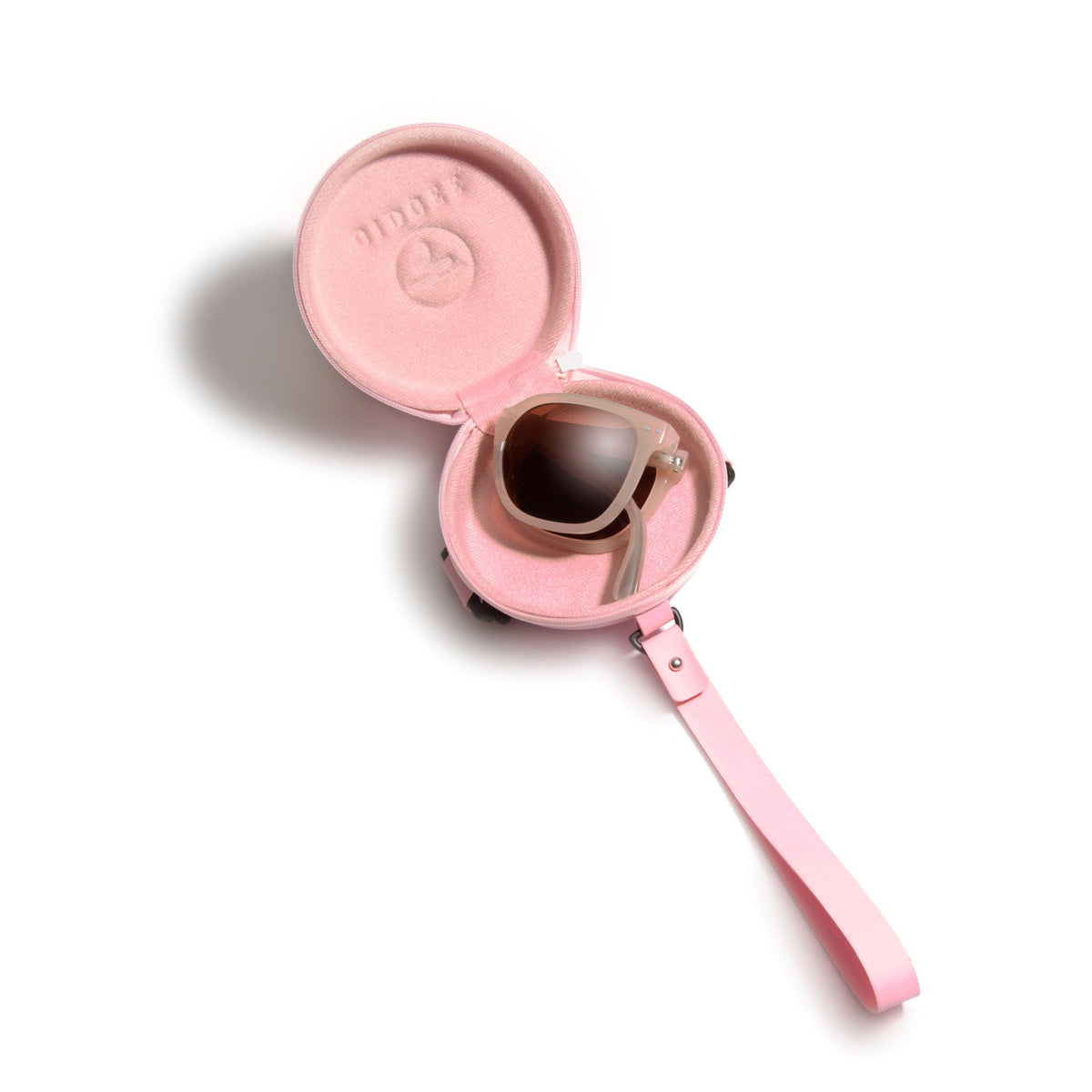Pink sunglasses case with sunglasses inside on a white background
