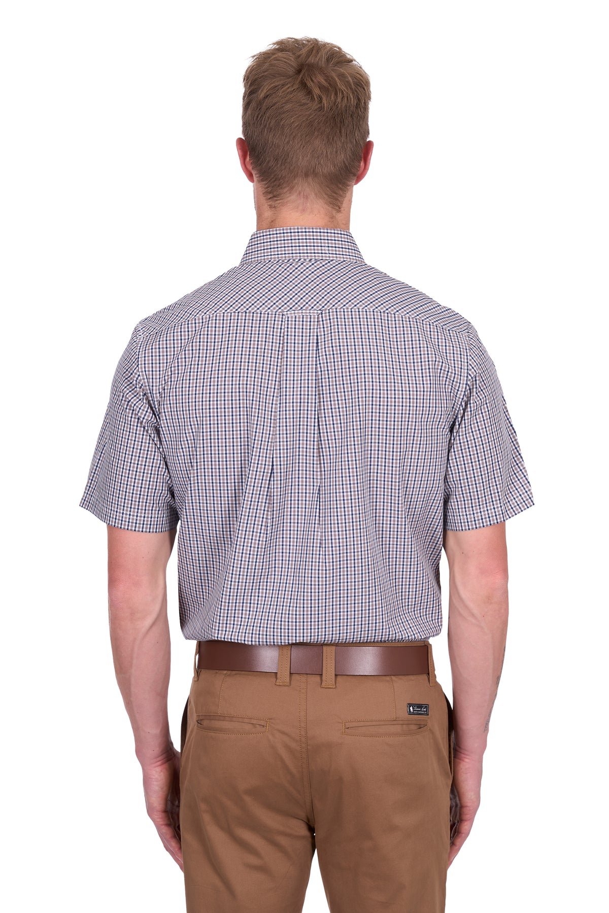 Thomas Cook Men's Will S/S Shirt. Man wearing a checkered shirt and brown pants on a white background