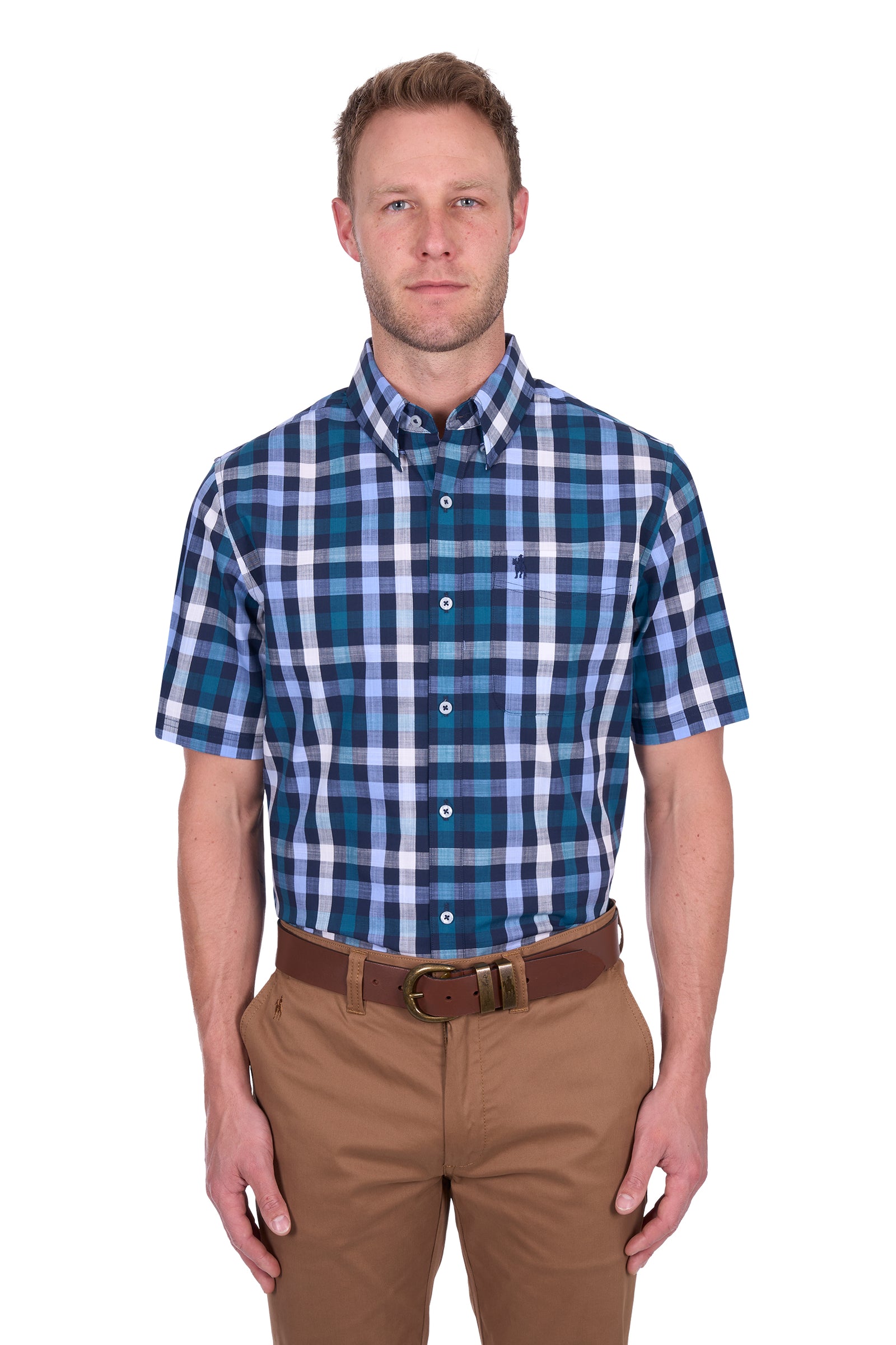 Thomas Cook Men's John S/S Shirt. Man wearing a blue plaid shirt and brown pants on a white background