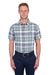 Man wearing a Thomas Cook Men's Gerry Linen S/S Shirt. Green and navy plaid shirt and navy pants on a white background