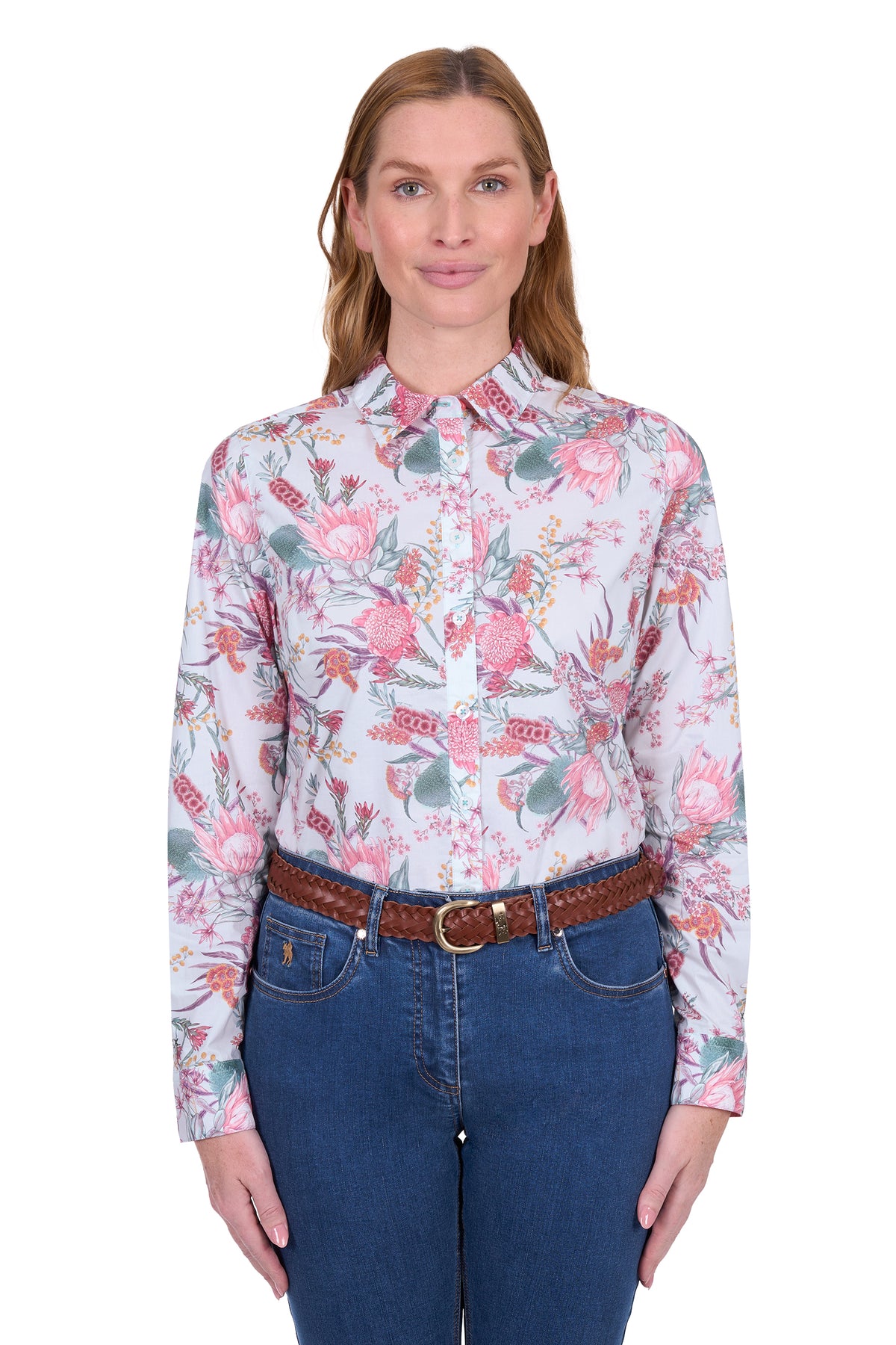 Thomas Cook Women's Ella L/S Shirt. Woman wearing a floral shirt and blue jeans on a white background