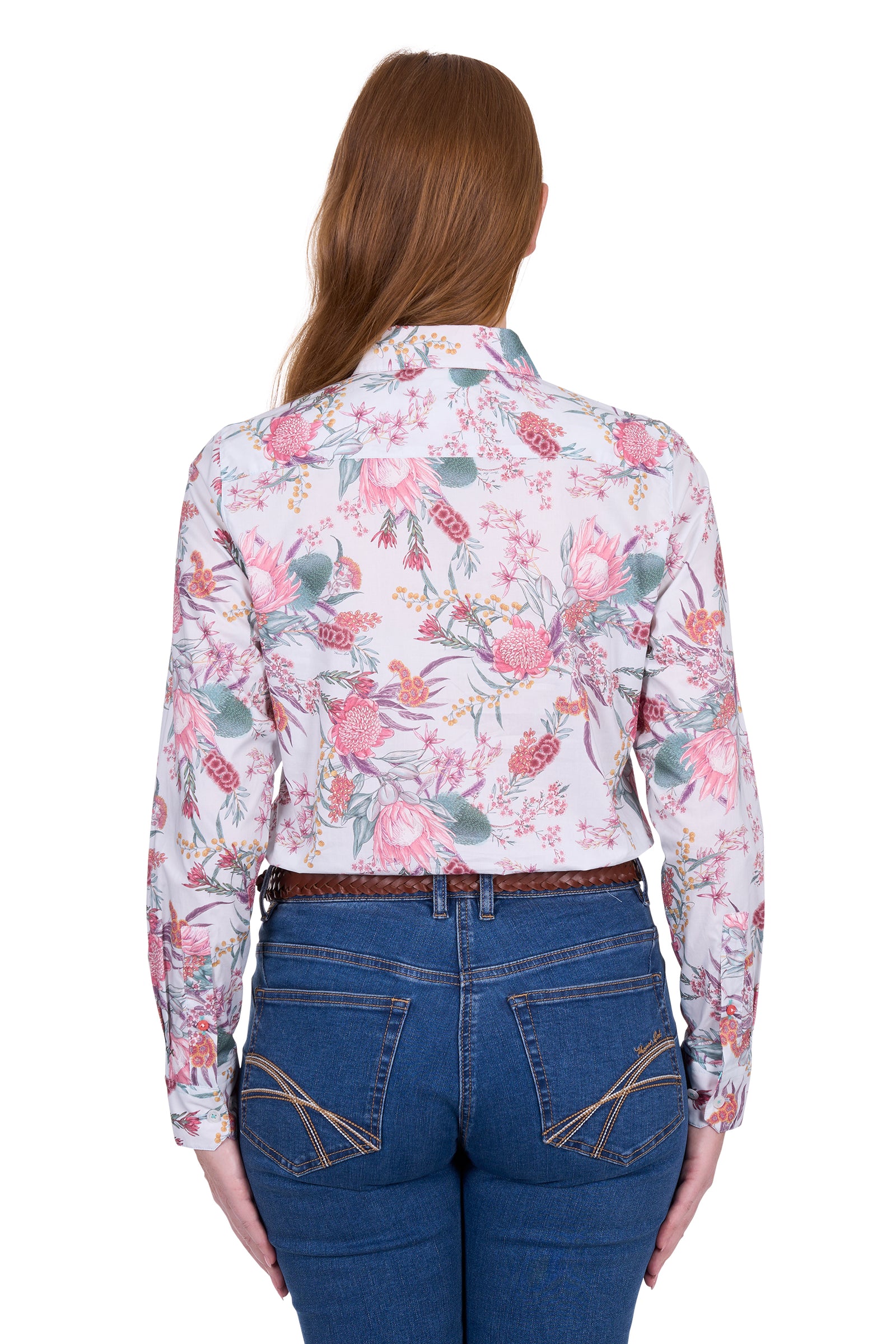 Thomas Cook Women's Ella L/S Shirt. Woman wearing a floral shirt and blue jeans on a white background