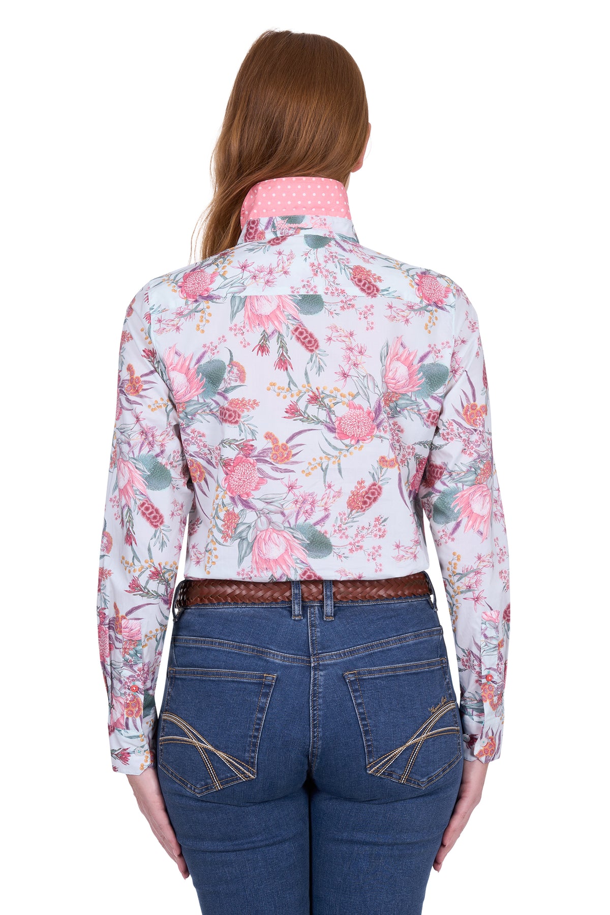 Thomas Cook Women's Ella L/S Shirt. Woman wearing a floral long-sleeve shirt and blue jeans on a white background