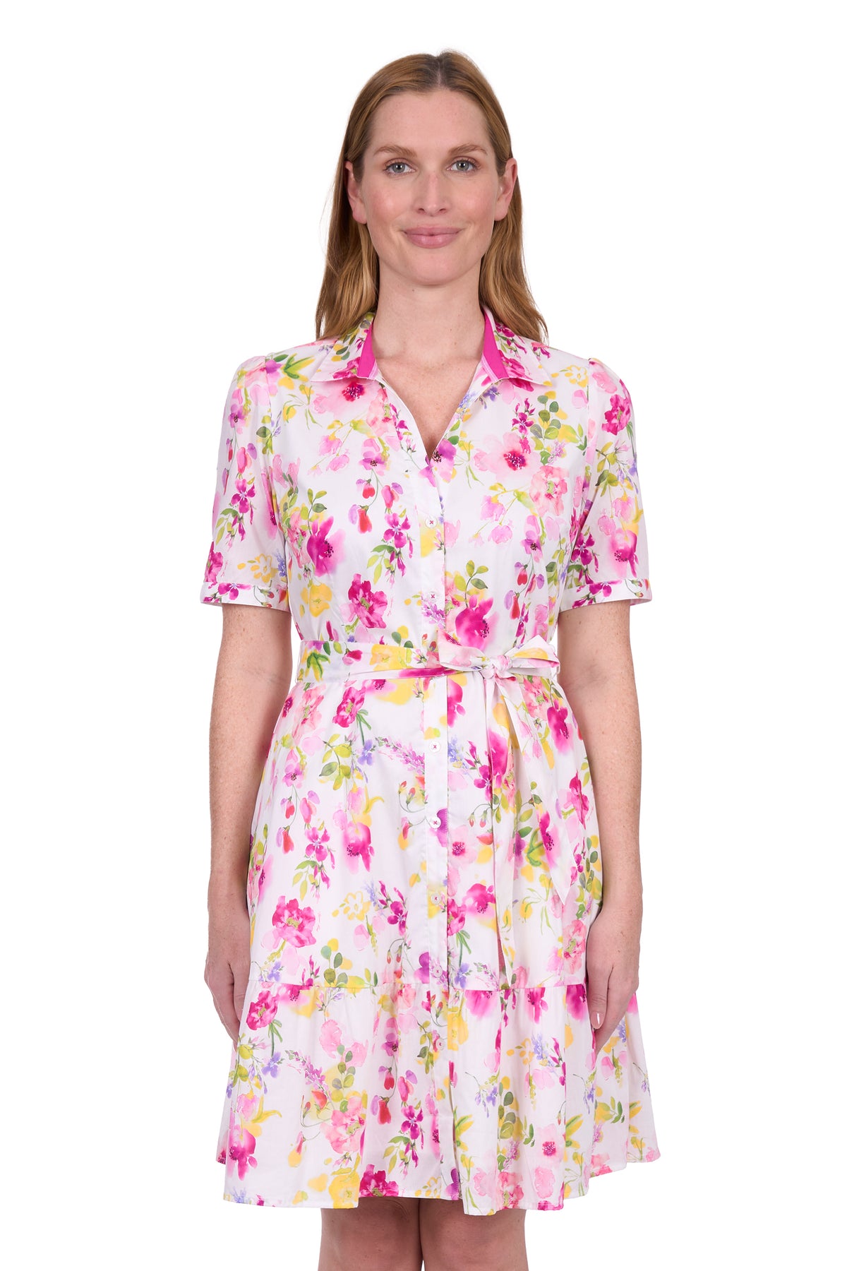 Thomas Cook Women's Flora S/S Dress. Woman wearing a floral dress on a white background