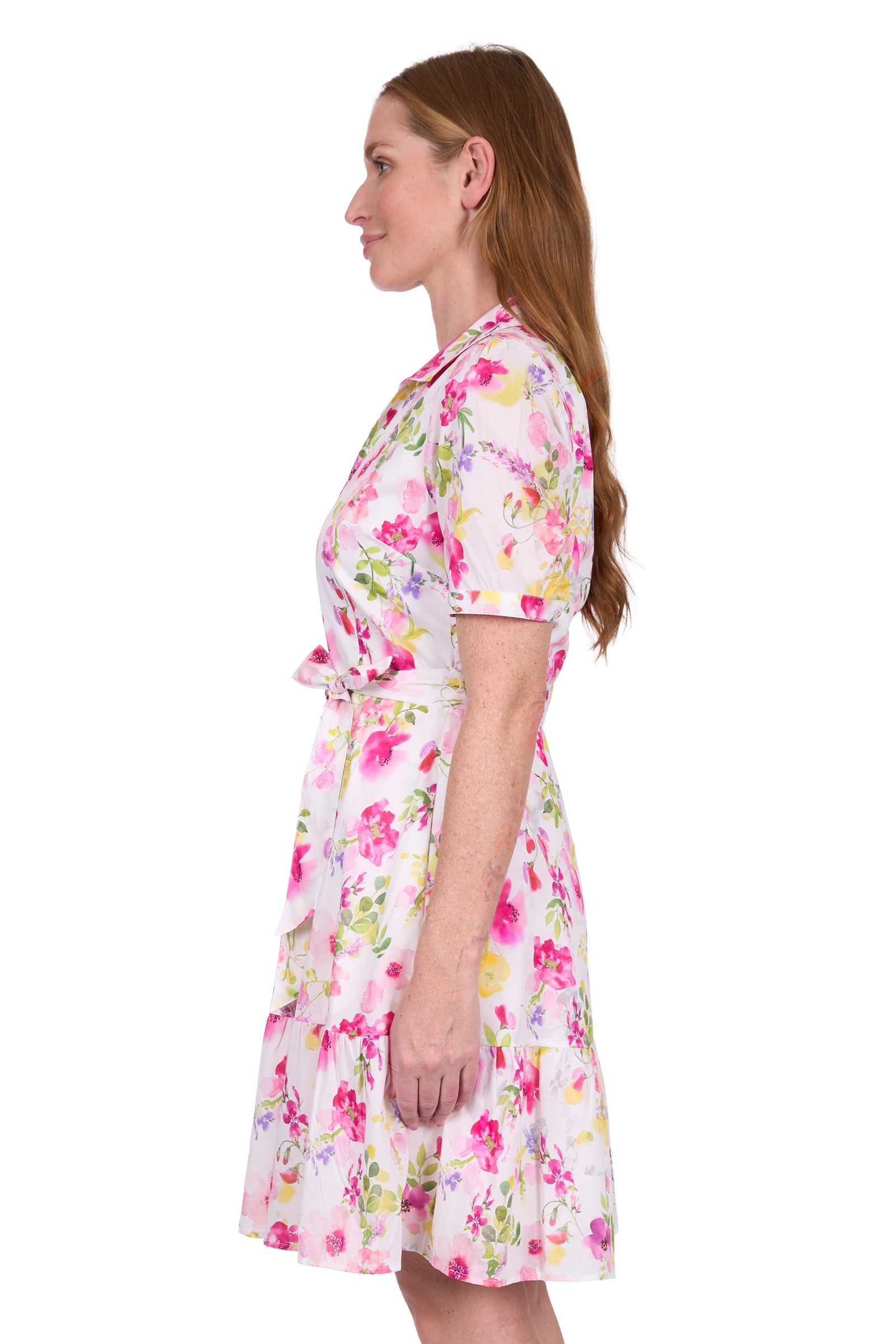 Thomas Cook Women's Flora S/S Dress. Woman wearing a floral dress on a white background