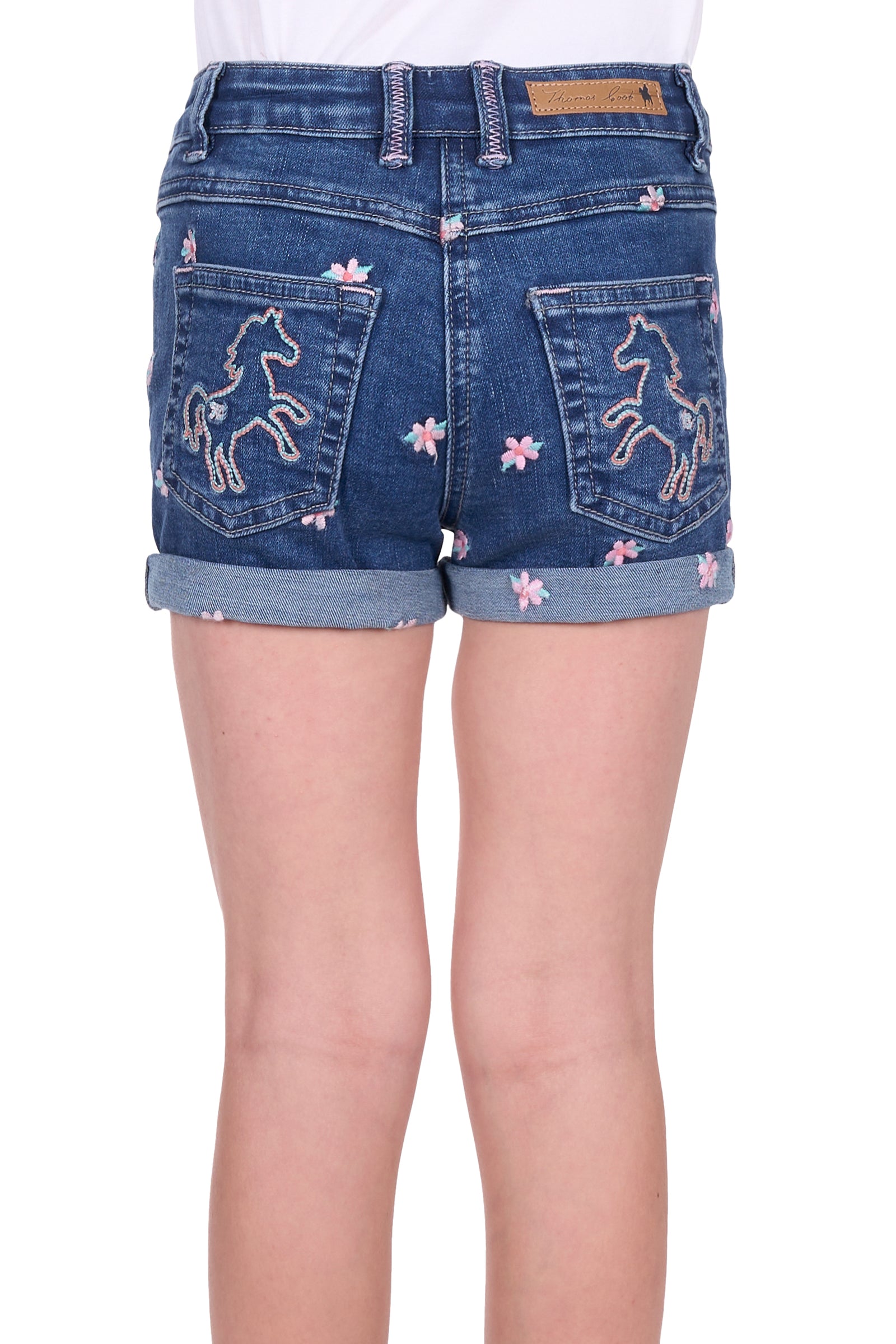 Rear view of Thomas Cook Girl's Hailey Denim Short. Blue denim shorts with floral and horse embroidery on a white background