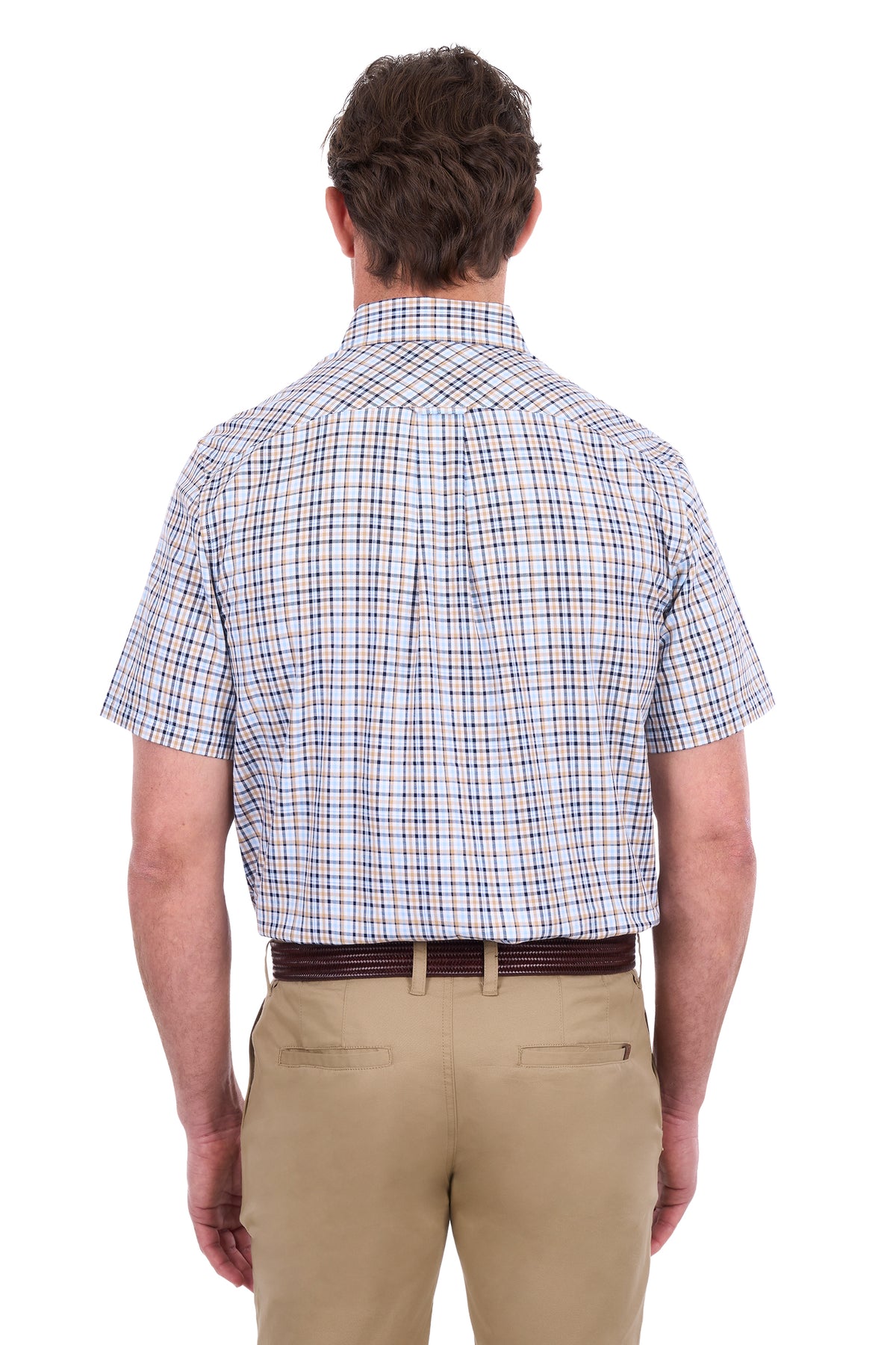 A man viewed from the back wearing a short-sleeve button-down shirt with a white base and a blue and red windowpane plaid pattern, paired with khaki pants and a dark brown belt, against a plain white background.