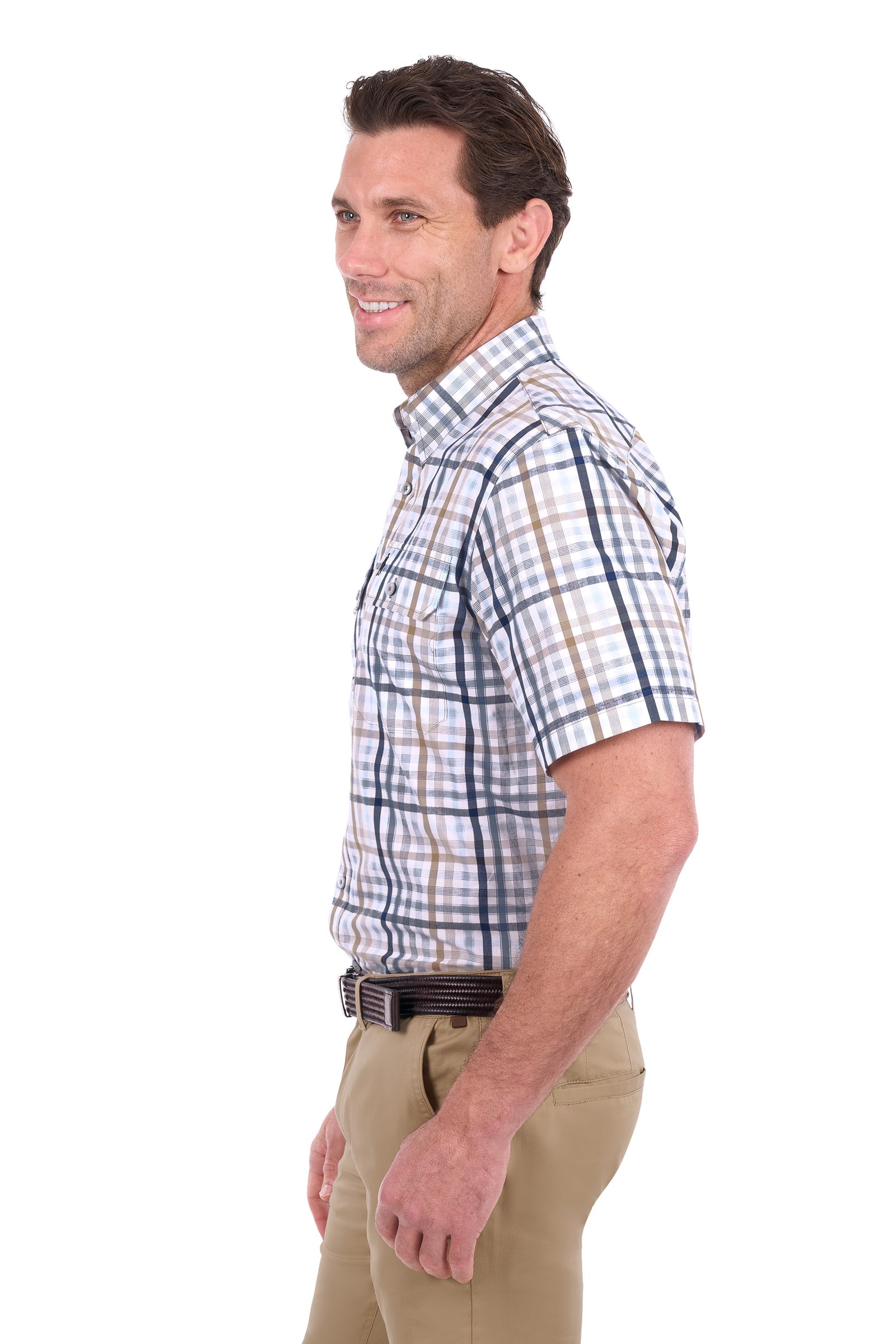 A man shown in profile wearing a short-sleeve button-up plaid shirt with blue, white, and tan lines, paired with khaki pants, against a plain white background.