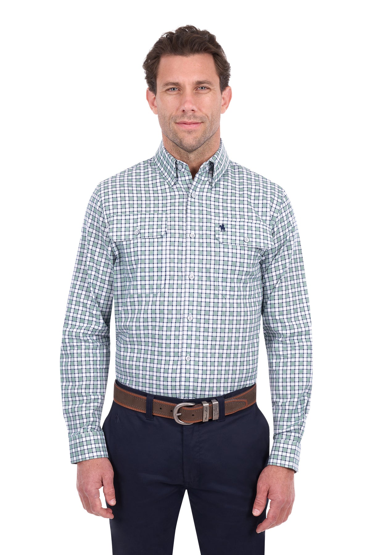 A man wearing a long-sleeve button-down shirt with a blue and white grid pattern, paired with dark navy pants and a brown belt, standing against a plain white background.