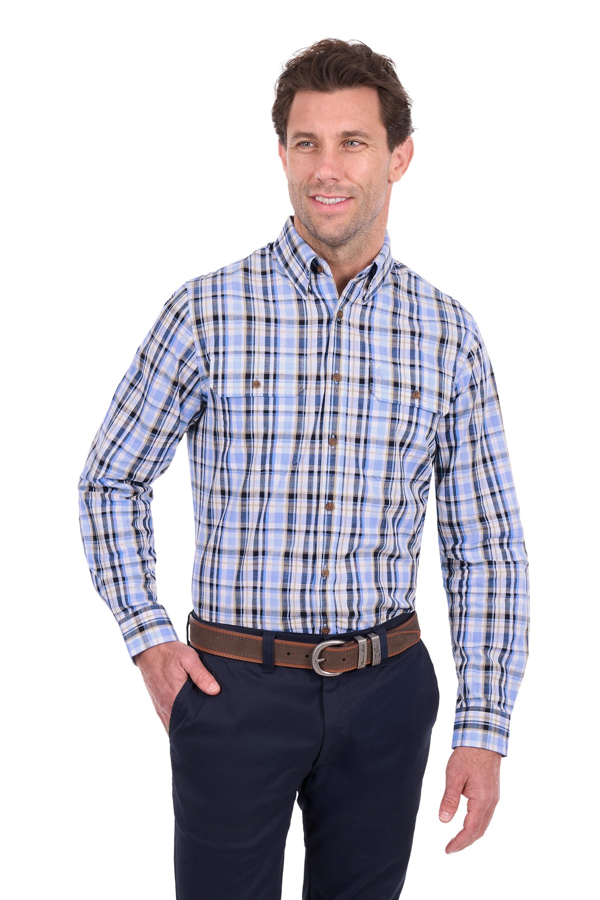A man wearing a long-sleeve button-down plaid shirt in light blue, white, and black, paired with dark navy trousers and a brown belt, photographed against a solid white background.