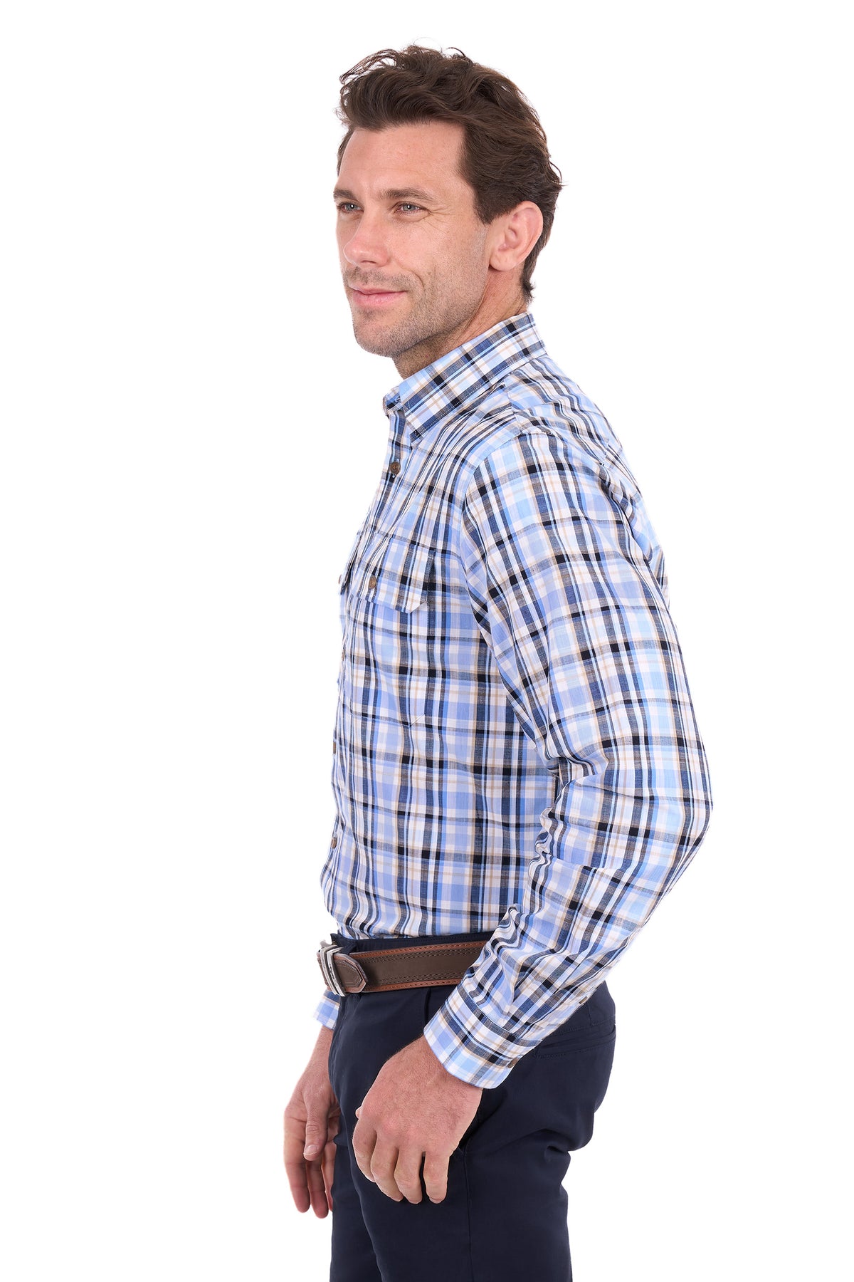 A man shown in profile wearing a light blue and white plaid long-sleeve button-down shirt, paired with dark trousers and a brown belt, against a plain white background.
