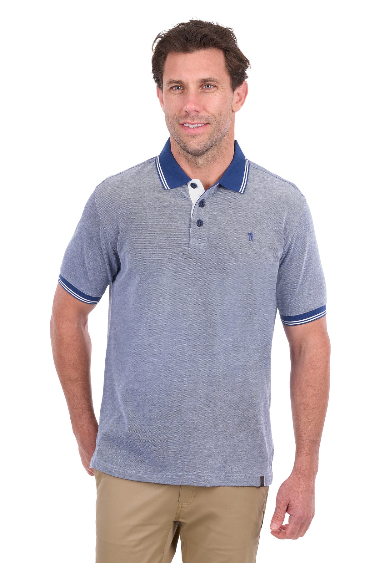 A man wearing a heathered blue polo shirt with a navy blue collar and sleeve trim, paired with khaki pants, against a plain white background.