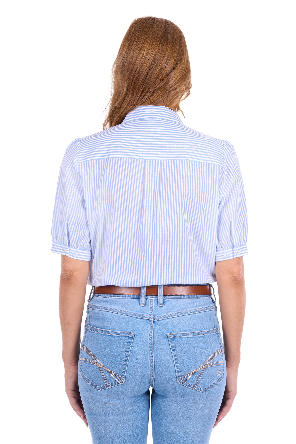 A woman viewed from the back wearing a light blue and white vertically striped short-sleeve button-up shirt with puff sleeves, paired with light blue jeans and a brown belt, against a plain white background.