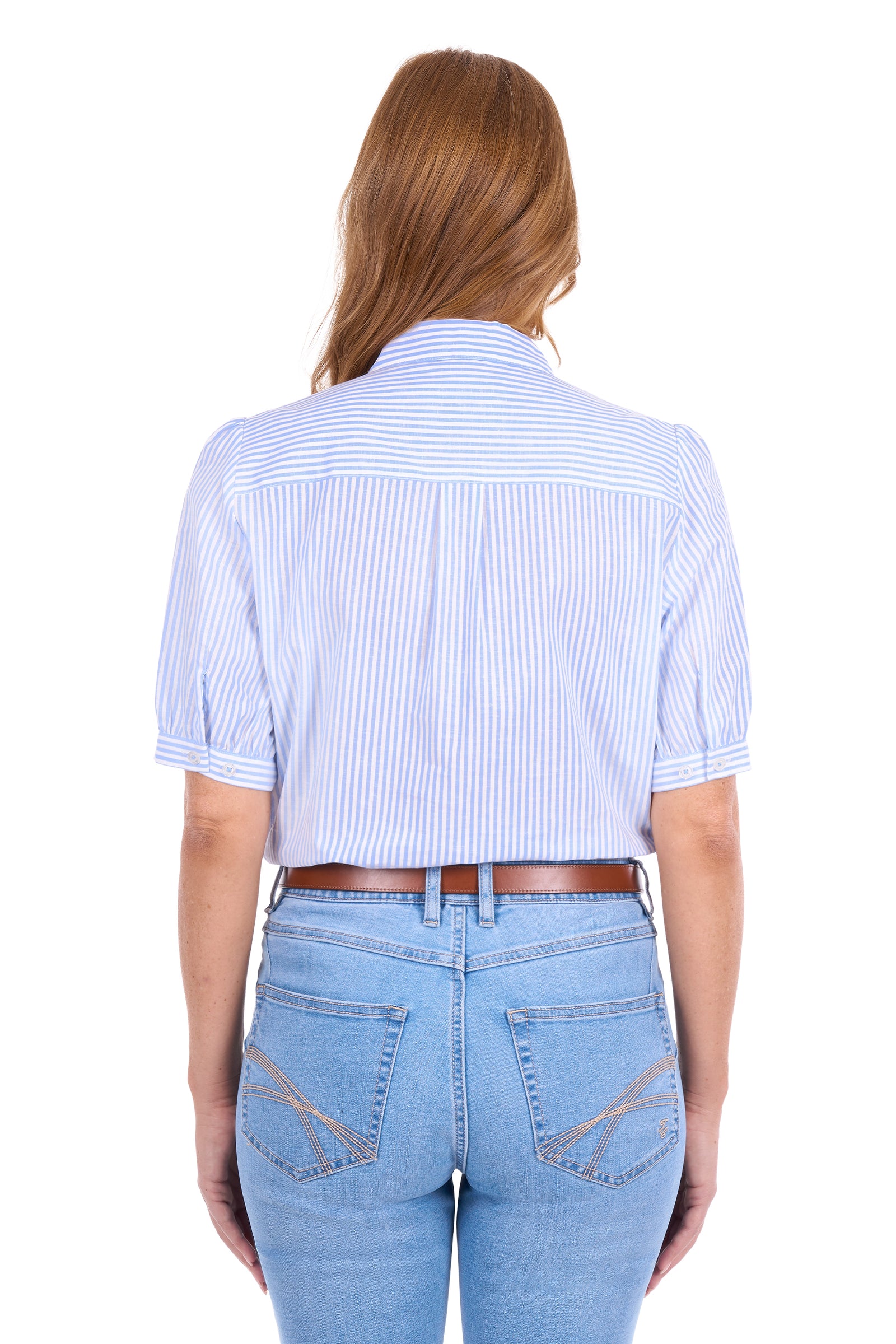 A woman viewed from the back wearing a light blue and white vertically striped short-sleeve button-up shirt with puff sleeves, paired with light blue jeans and a brown belt, against a plain white background.