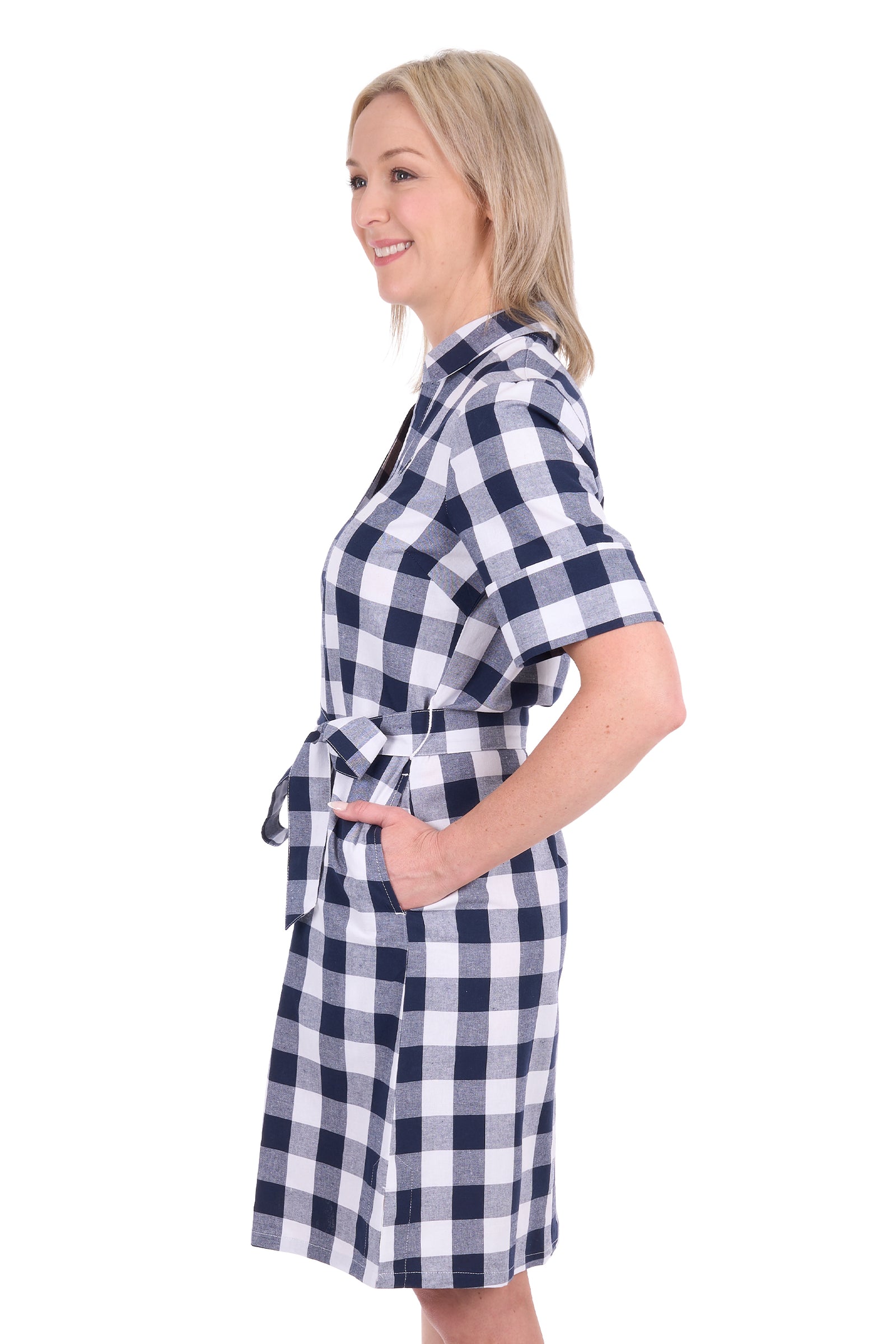 A woman modeling a short-sleeve gingham check wrap robe with a tie waist, shown in profile against a plain white background.