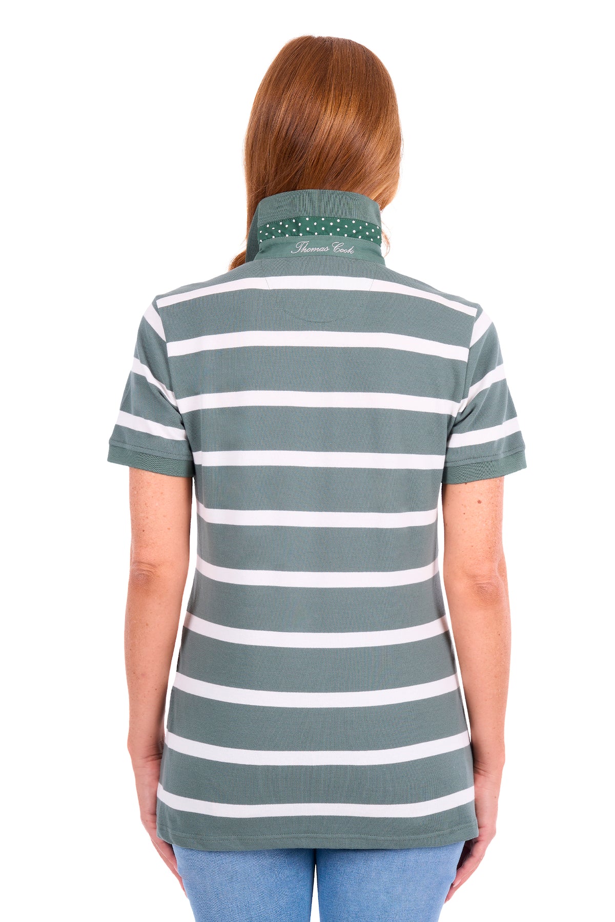 A woman viewed from the back wearing a short-sleeve polo shirt with horizontal sage green and white stripes, paired with blue jeans, against a plain white background.