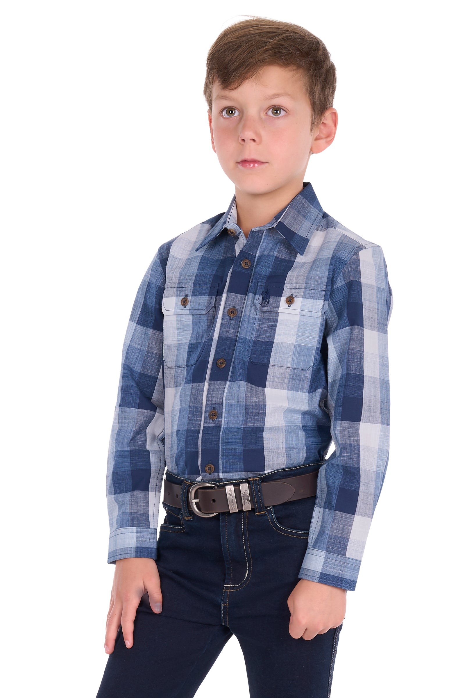 A young boy modeling a long-sleeve blue and white plaid button-down shirt, paired with dark jeans and a brown belt, against a solid white background.