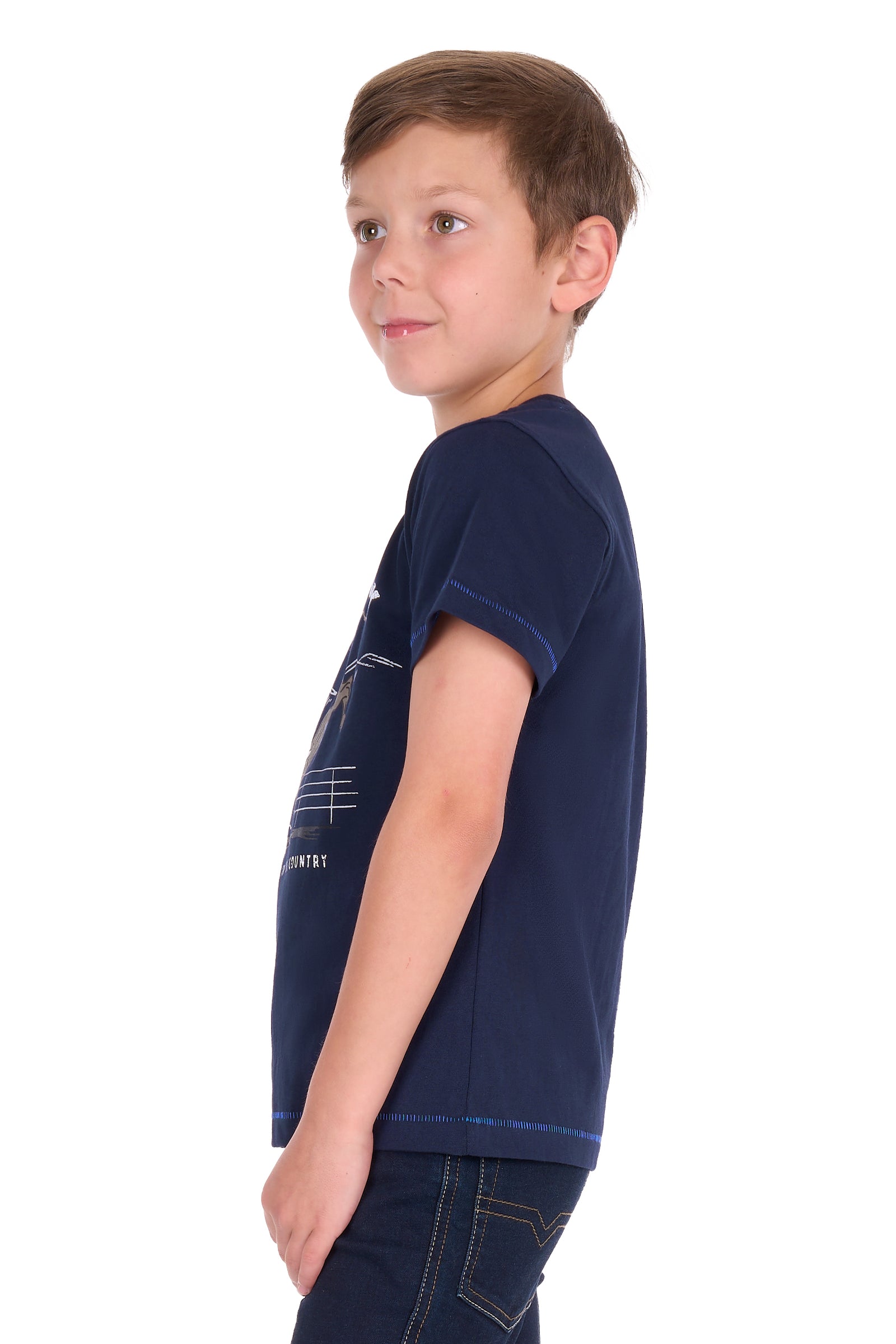 A young boy wearing a navy blue short-sleeve t-shirt with a white graphic print on the front, shown in profile against a solid white background.