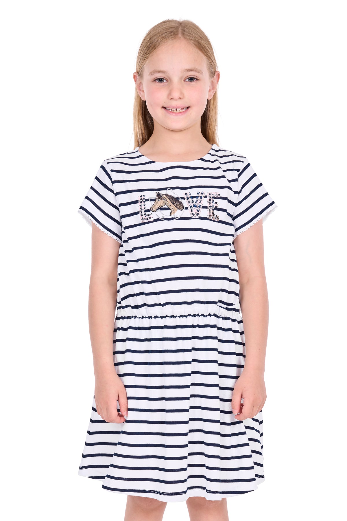 A young girl with blonde hair stands against a white background wearing a short-sleeve navy and white striped dress with a 'LOVE' graphic across the chest.