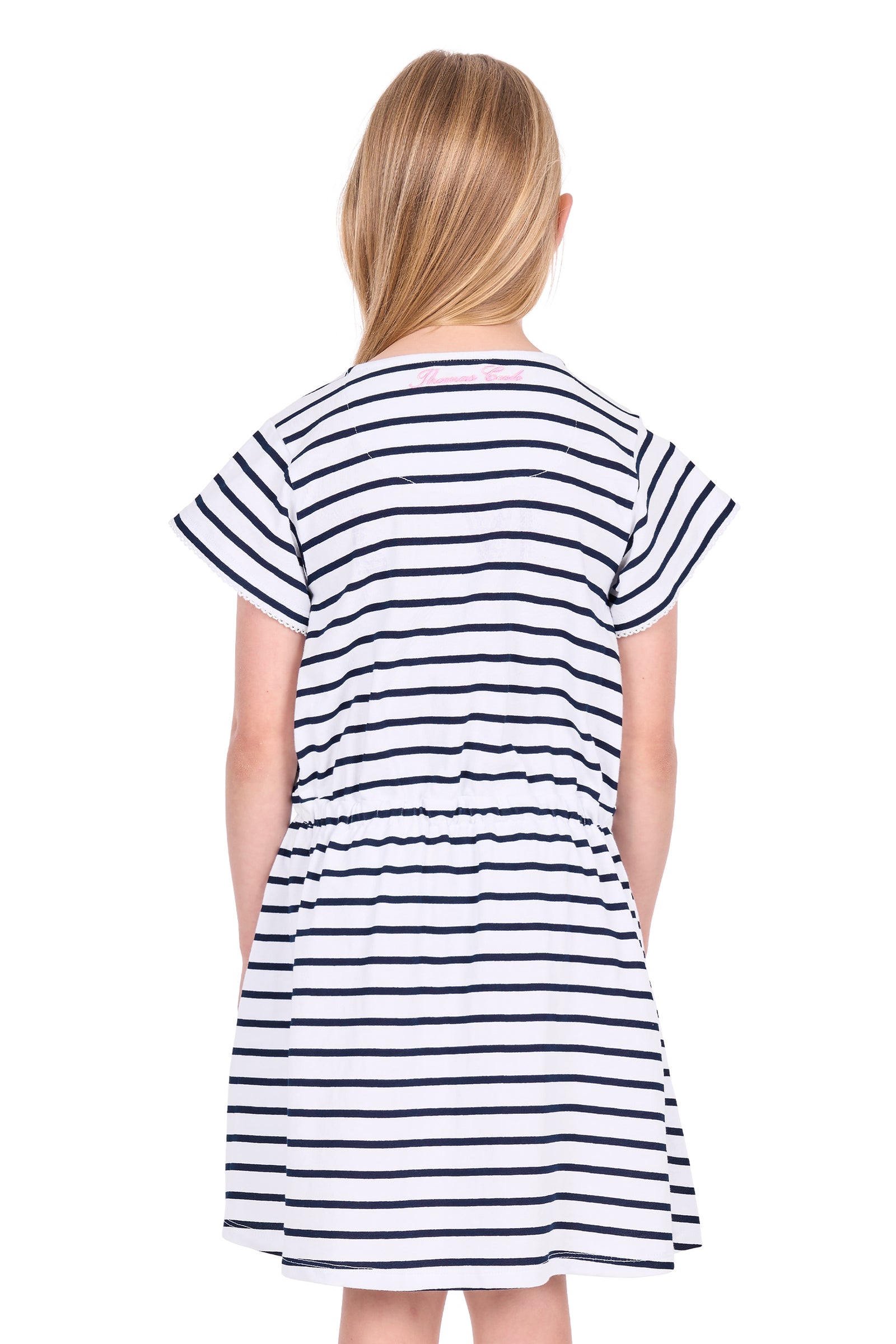 A young girl viewed from behind wearing a short-sleeve dress with horizontal navy blue and white stripes, set against a plain white background.