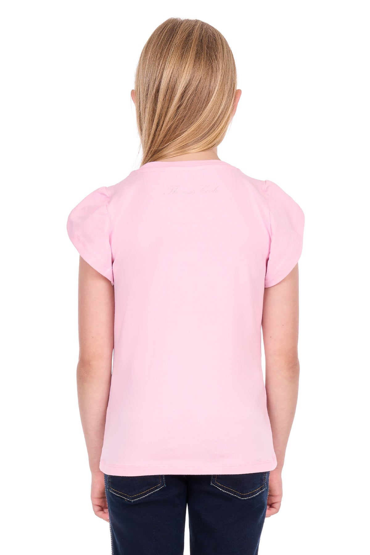 A young girl with blonde hair, viewed from behind, wearing a light pink short-sleeve t-shirt and dark blue jeans against a white background.