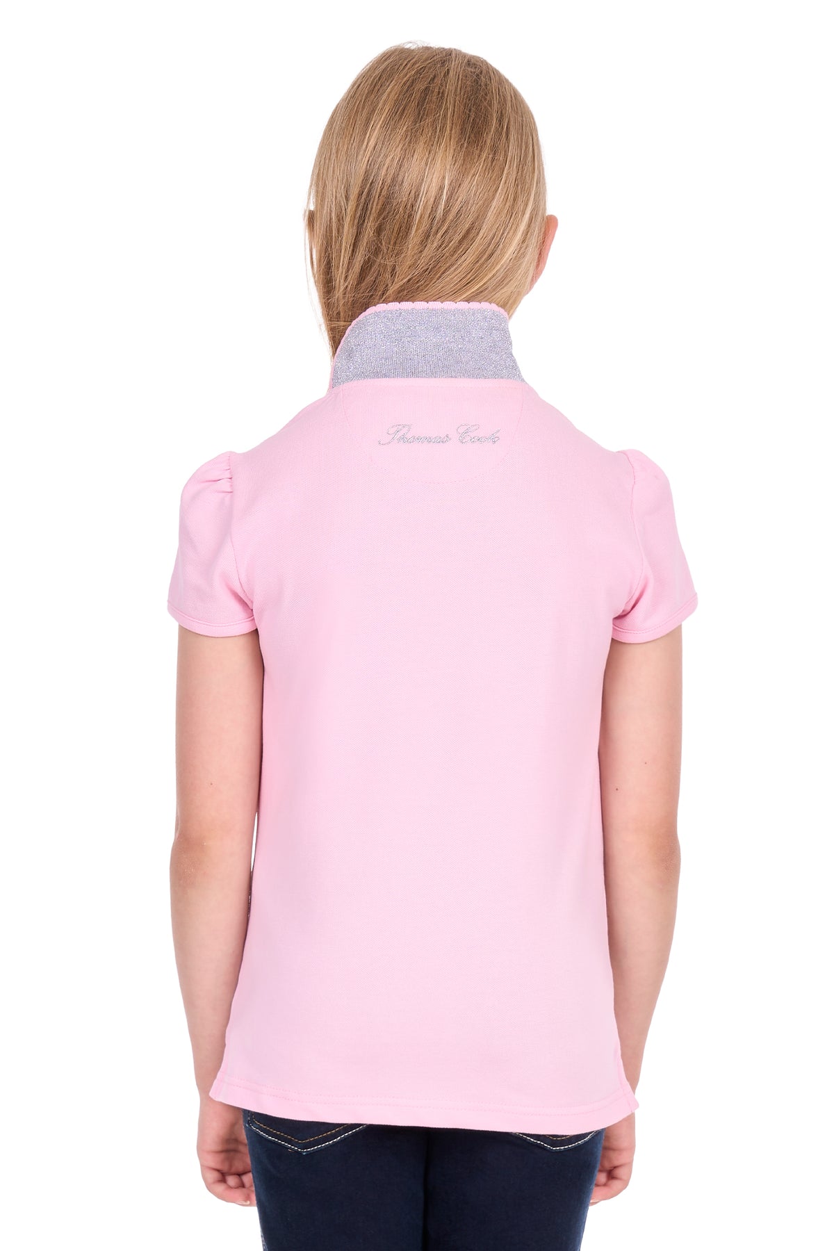 A child model shown from the back wearing a light pink polo shirt with a gray collar and small cursive script on the upper back, paired with dark jeans against a white background.