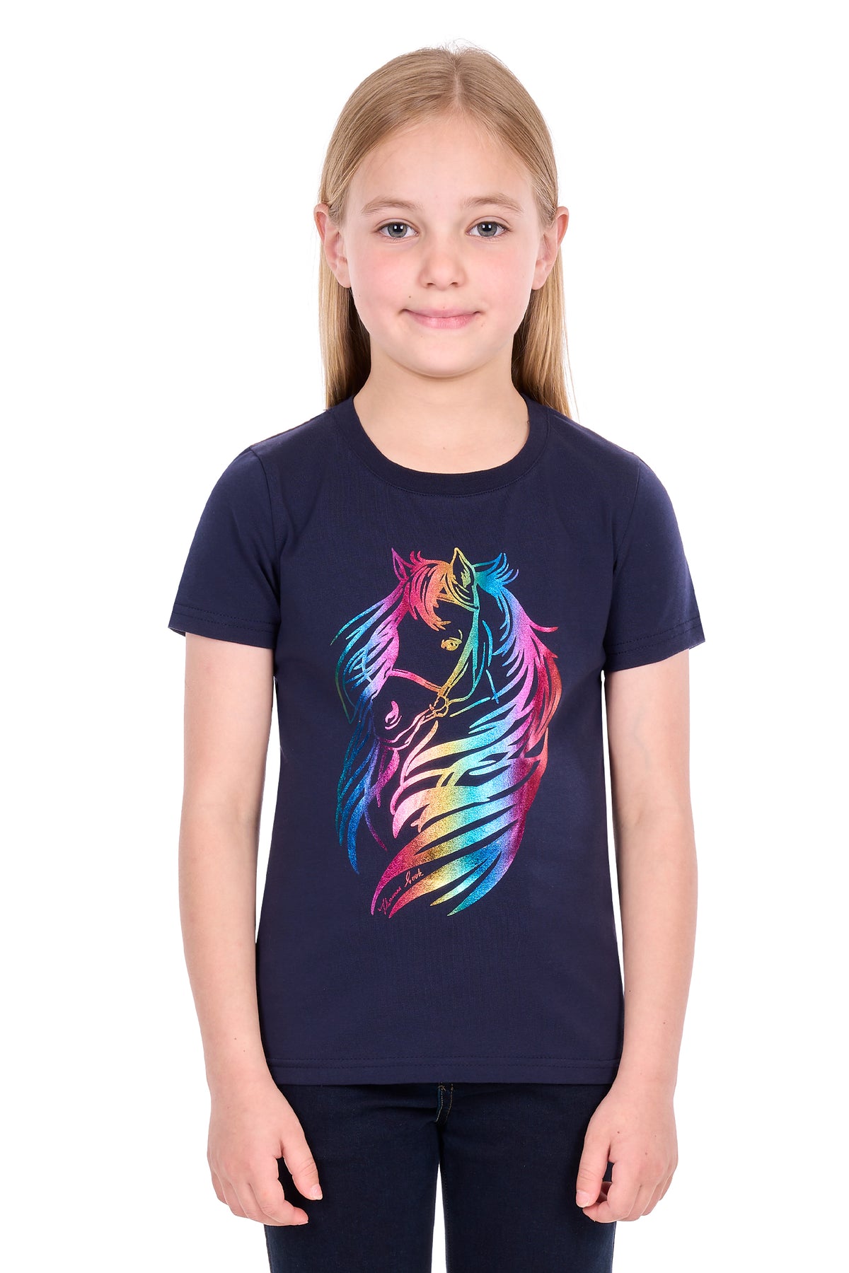 A young girl with blonde hair wearing a navy blue short-sleeve t-shirt with a colorful rainbow unicorn graphic on the front, standing against a plain white background.