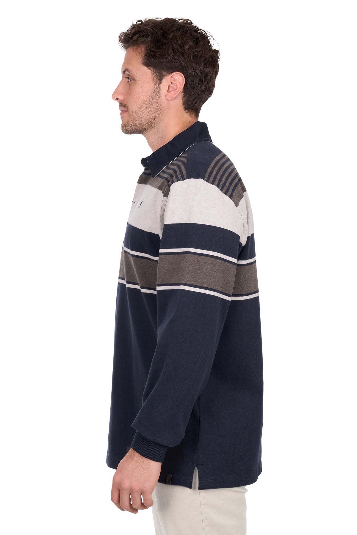 Man wearing a navy, white, and brown striped sweater on a white background