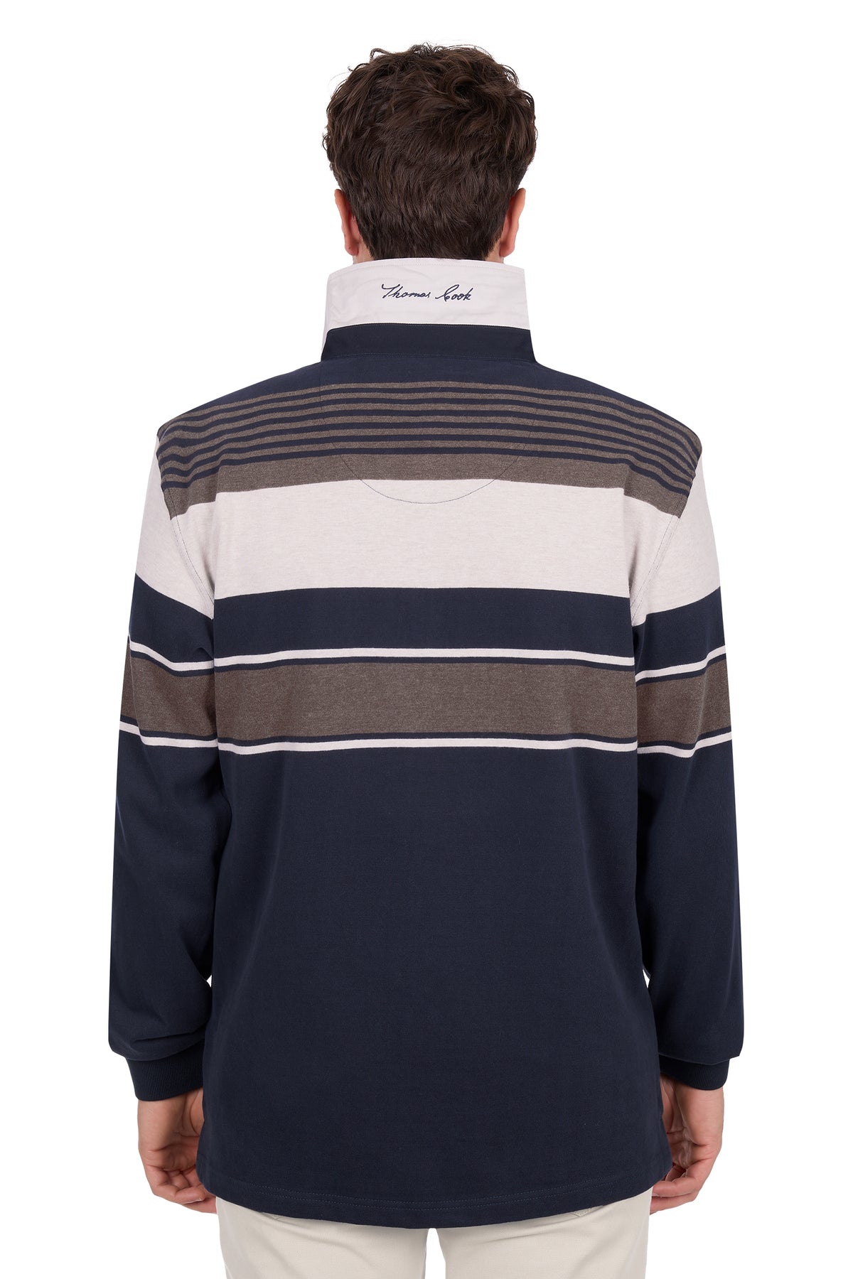 Man wearing a striped rugby shirt with a visible brand logo on the back.