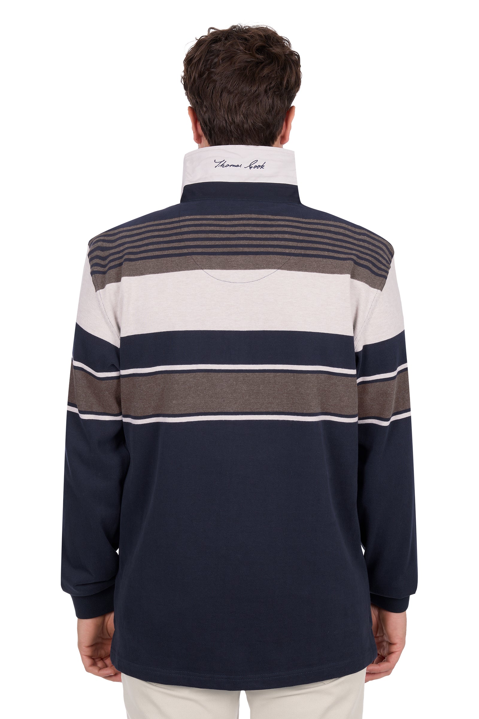 Man wearing a striped rugby shirt with a visible brand logo on the back.