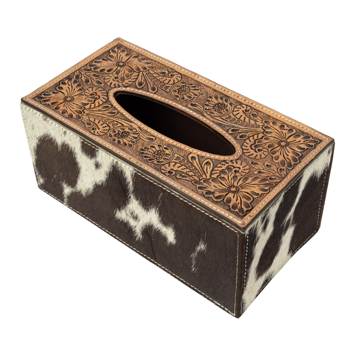 Tissue box cover with decorative brown leather top and cowhide patterned base on a white background