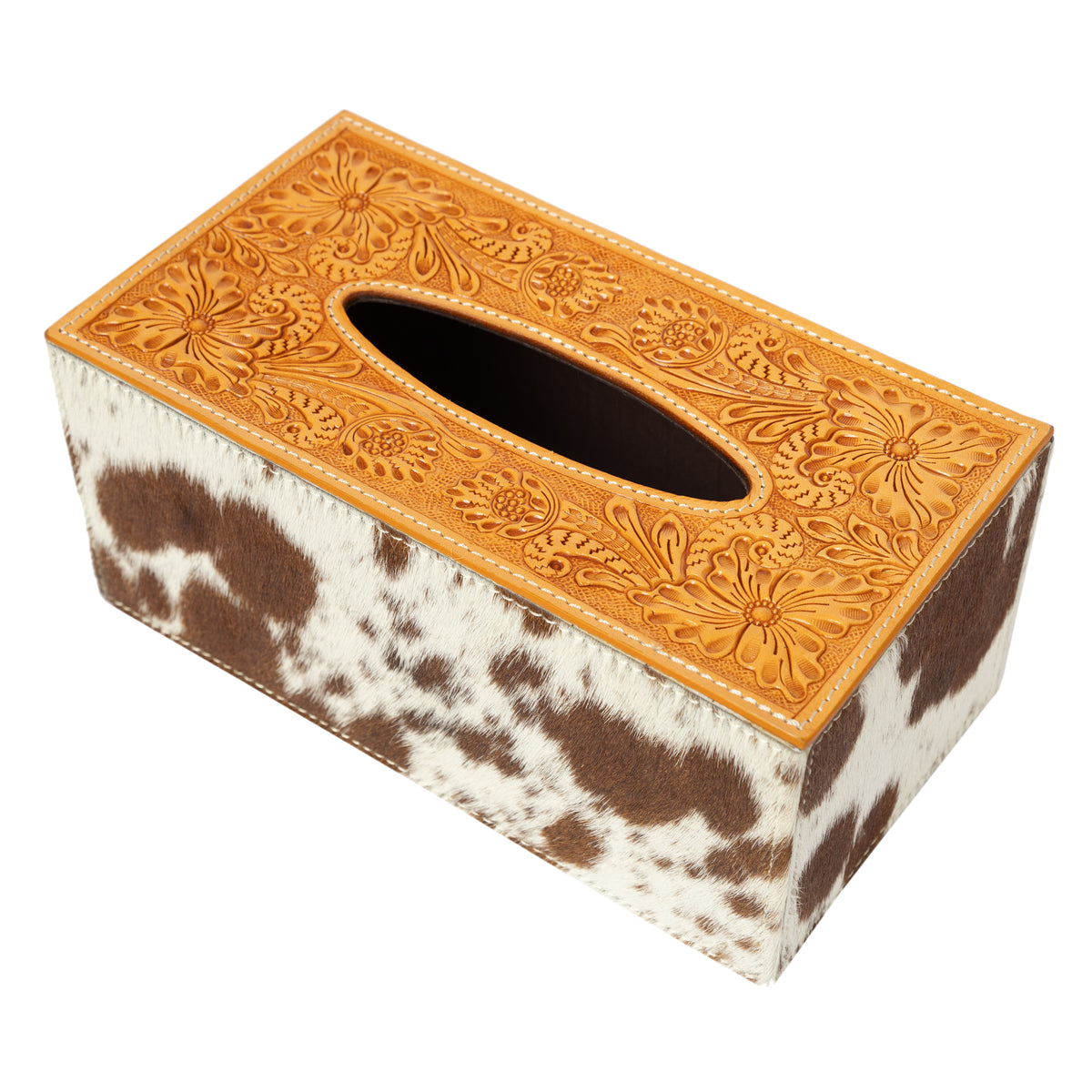 Tissue box cover with cow print and embossed leather design on a white background