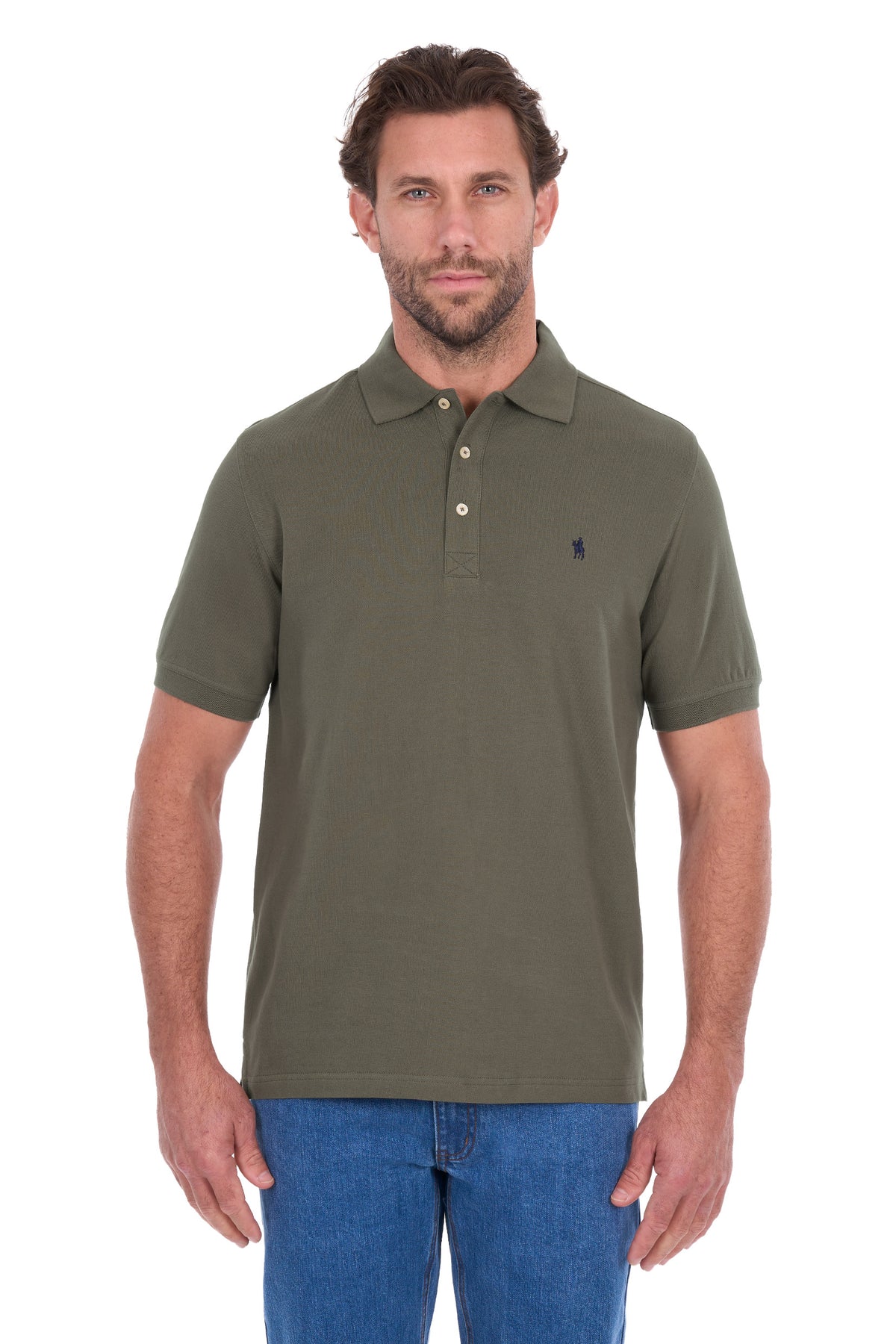 A man wearing an olive green short-sleeve polo shirt with a three-button placket and a small embroidered logo on the left chest, paired with blue jeans, against a plain white background.
