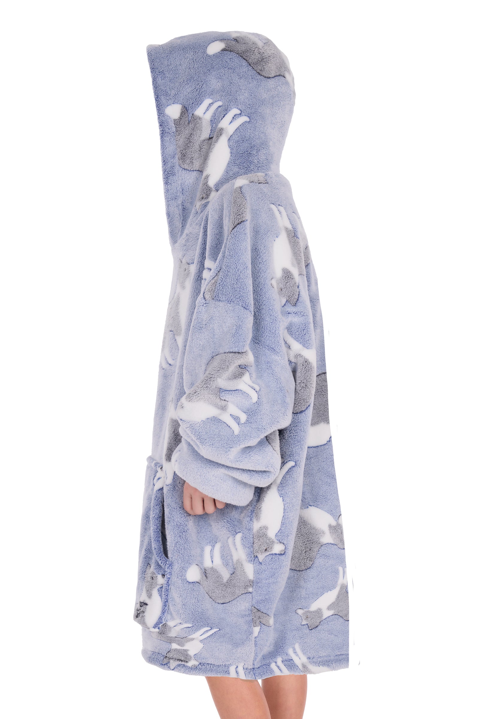 Child wearing a blue hooded blanket with dog patterns on a white background