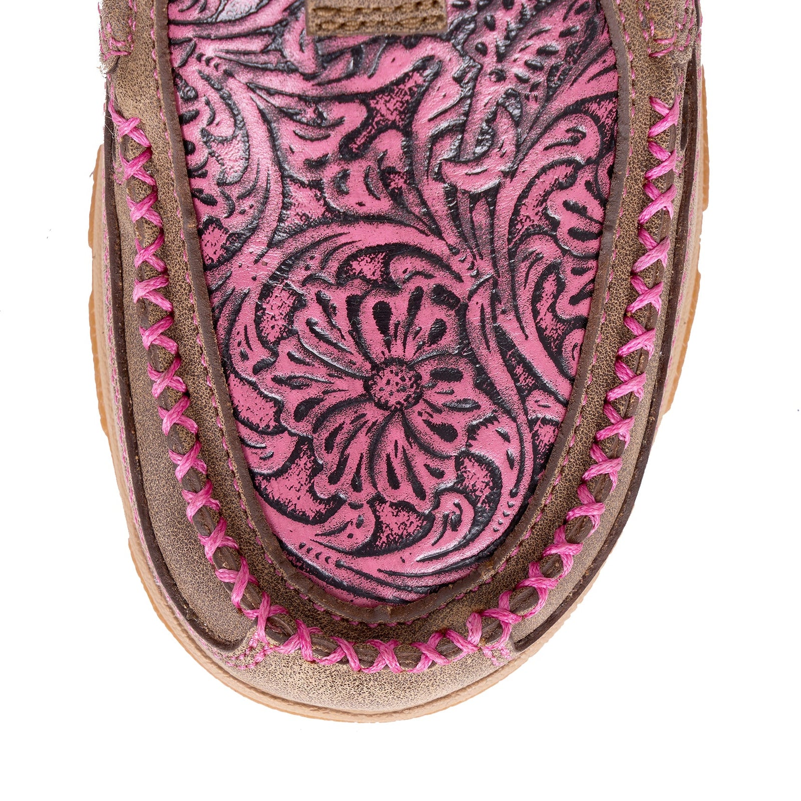 Twisted X Women's Tooled Pink CellStretch Mocs Slip On. Close-up of a sandal with pink and brown floral pattern on a white background