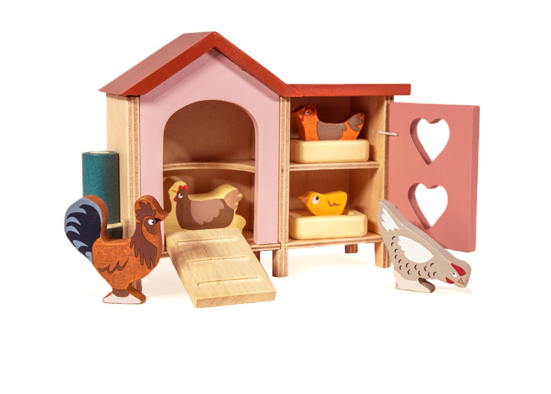 Kaleidoscope Chicken Coop. Wooden toy chicken coop with chickens and a duck on a white background