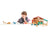 Kaleidoscope Tender Leaf Farm. Child playing with toy farm set on a white background